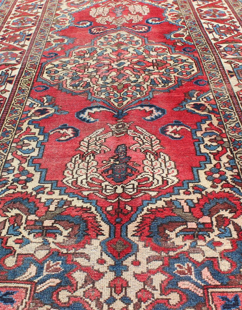 20th Century Vintage Persian Bakhtiari Rug with Ornate Central Medallion and Rich Red Blue For Sale