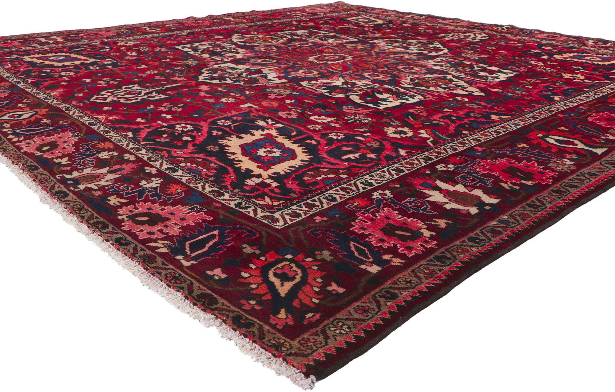 61118 Vintage Persian Bakhtiari Rug, 10'00 x 10'05.Emanating a timeless design and beguiling beauty in saturated colors, this hand-knotted wool vintage Persian Bakhtiari rug is poised to impress. Taking center stage is a large eight-point central
