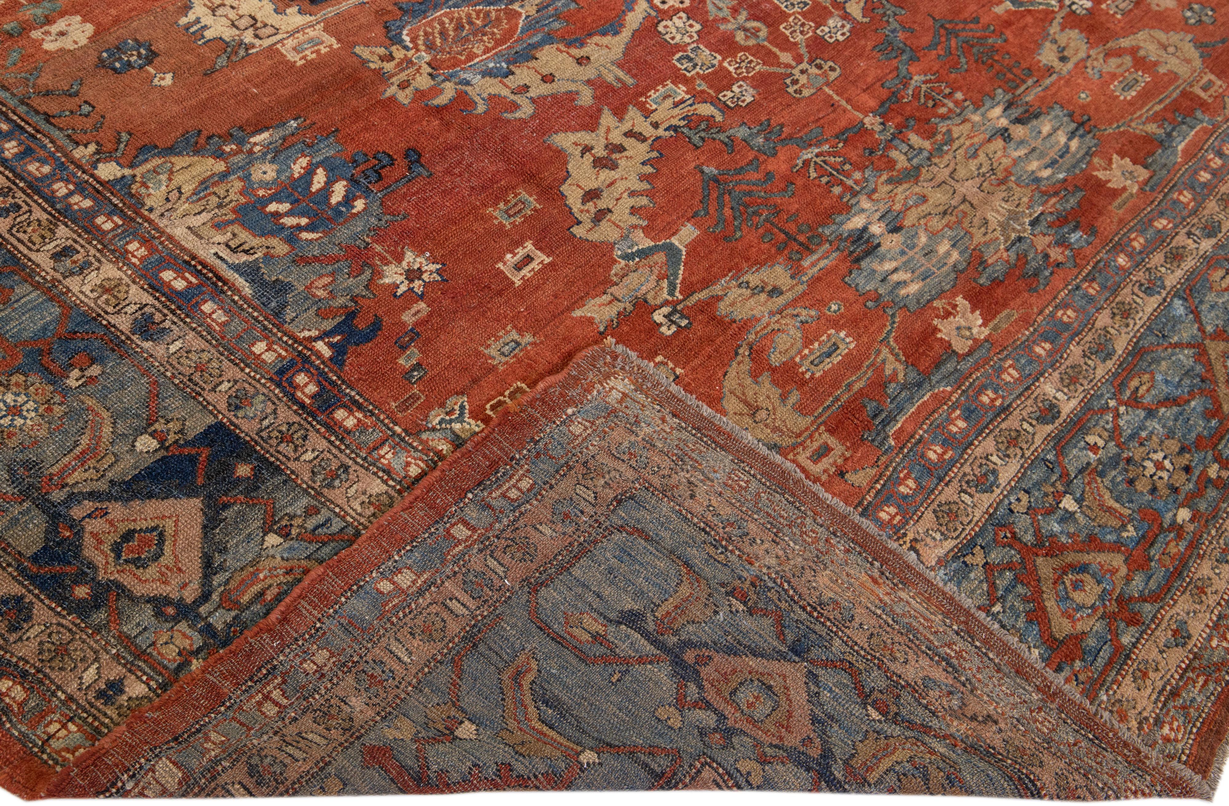 Schöne Vintage Persian Bakshaish handgeknüpften Wollteppich mit dem Orange-Rost-Farbfeld. Dieses Stück hat einen navyblauen Rahmen und mehrfarbige Akzente in einem kaukasischen Stammesmuster. 


Dieser Teppich misst: 9'9