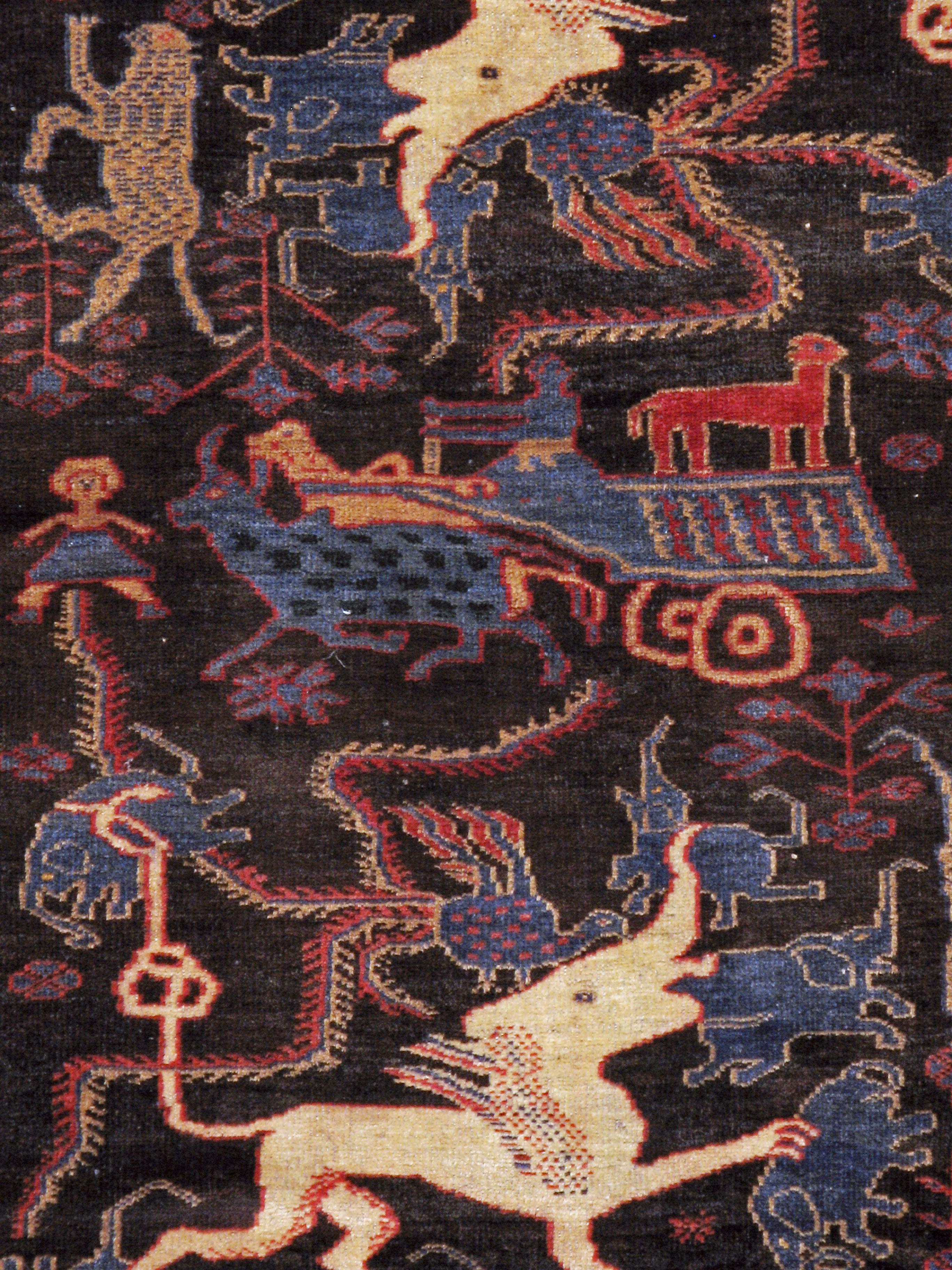 A vintage Persian Baluch pictorial rug from the mid-20th century.