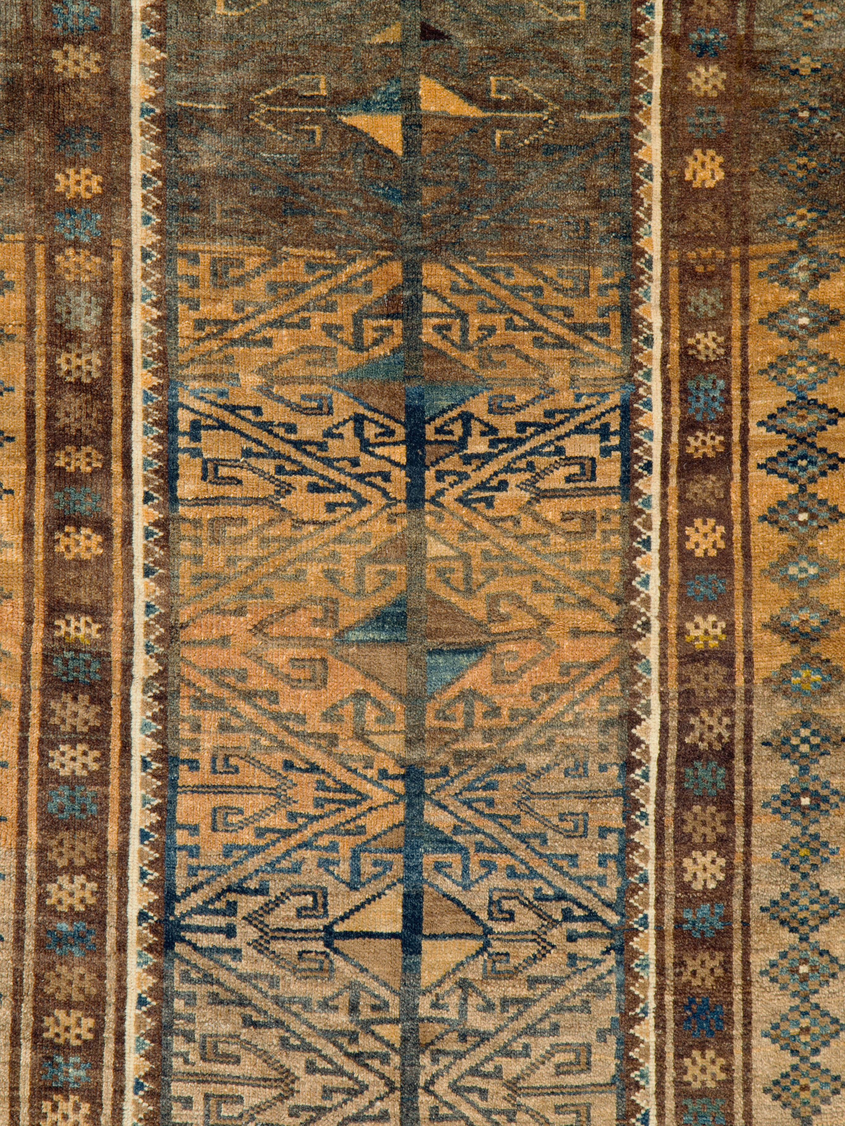 A vintage Persian Baluch rug from the mid-20th century.