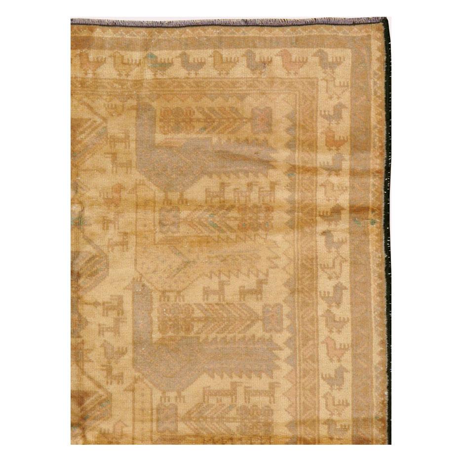A vintage Persian Baluch rug from the mid-20th century.

Measures: 3' 0