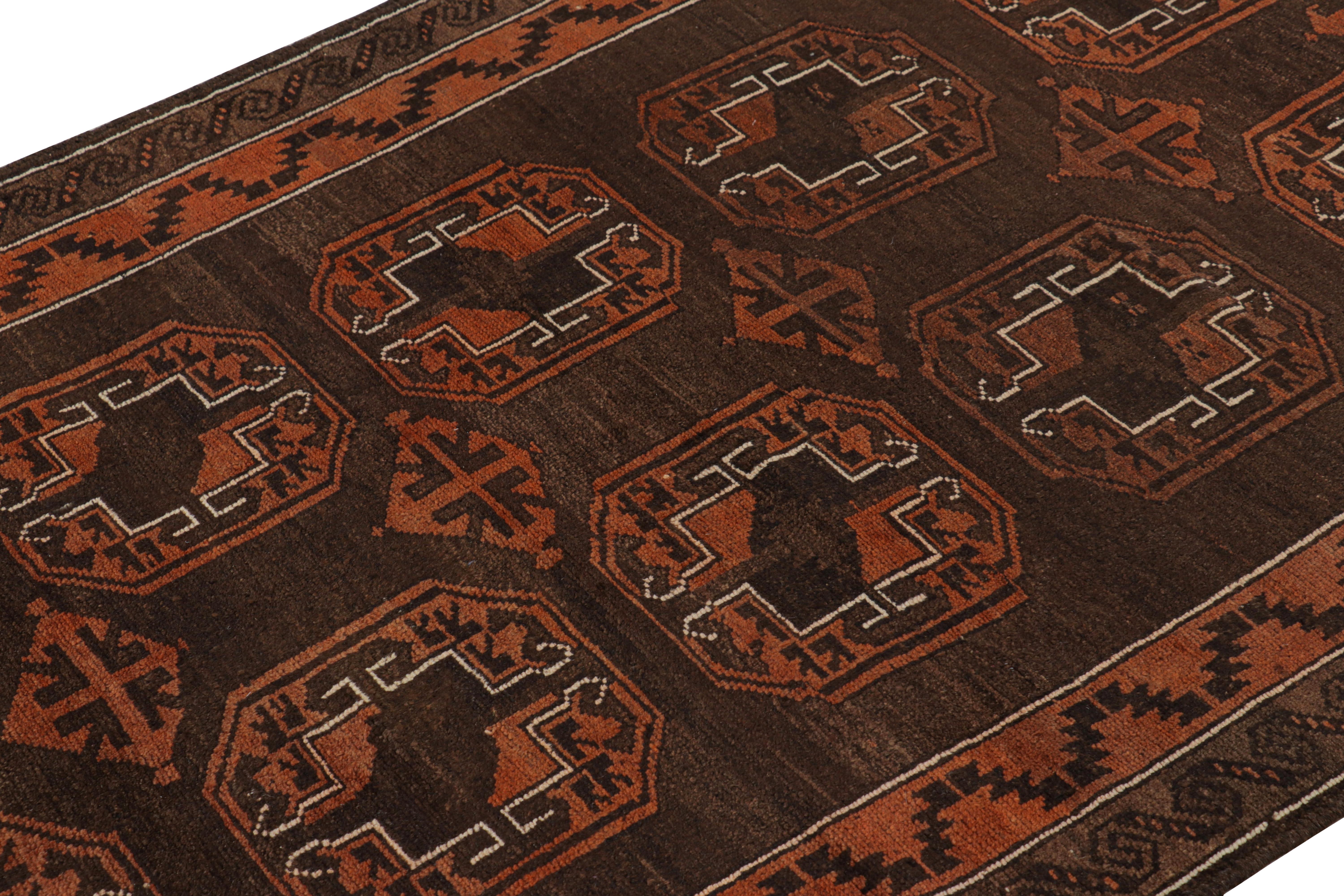 Hand-knotted in wool and originating circa 1950-1960, this 4x6 vintage Persian Baluch rug features a repeat of large-scale medallions and two borders with tribal geometric patterns.    

On The Design:

Admirers of the craft will note that Baluch