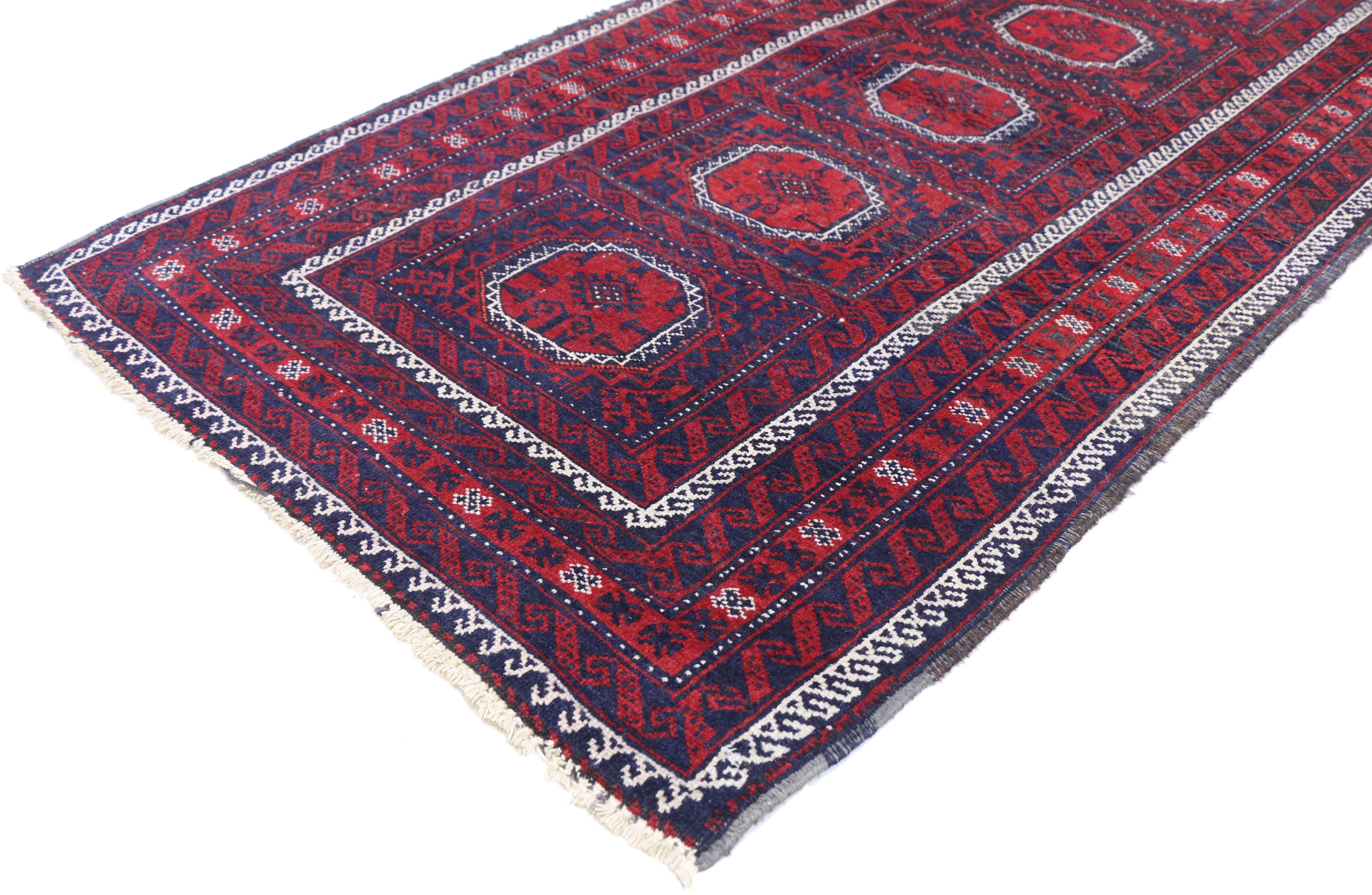 72044, Vintage Persian Baluch Rug with Jacobean Style and Saturated Colors. Exotic and alluring, tribal style takes its inspiration from this vintage Persian Baluch rug. Featuring five octagon medallions each filled with a diamond and secondary