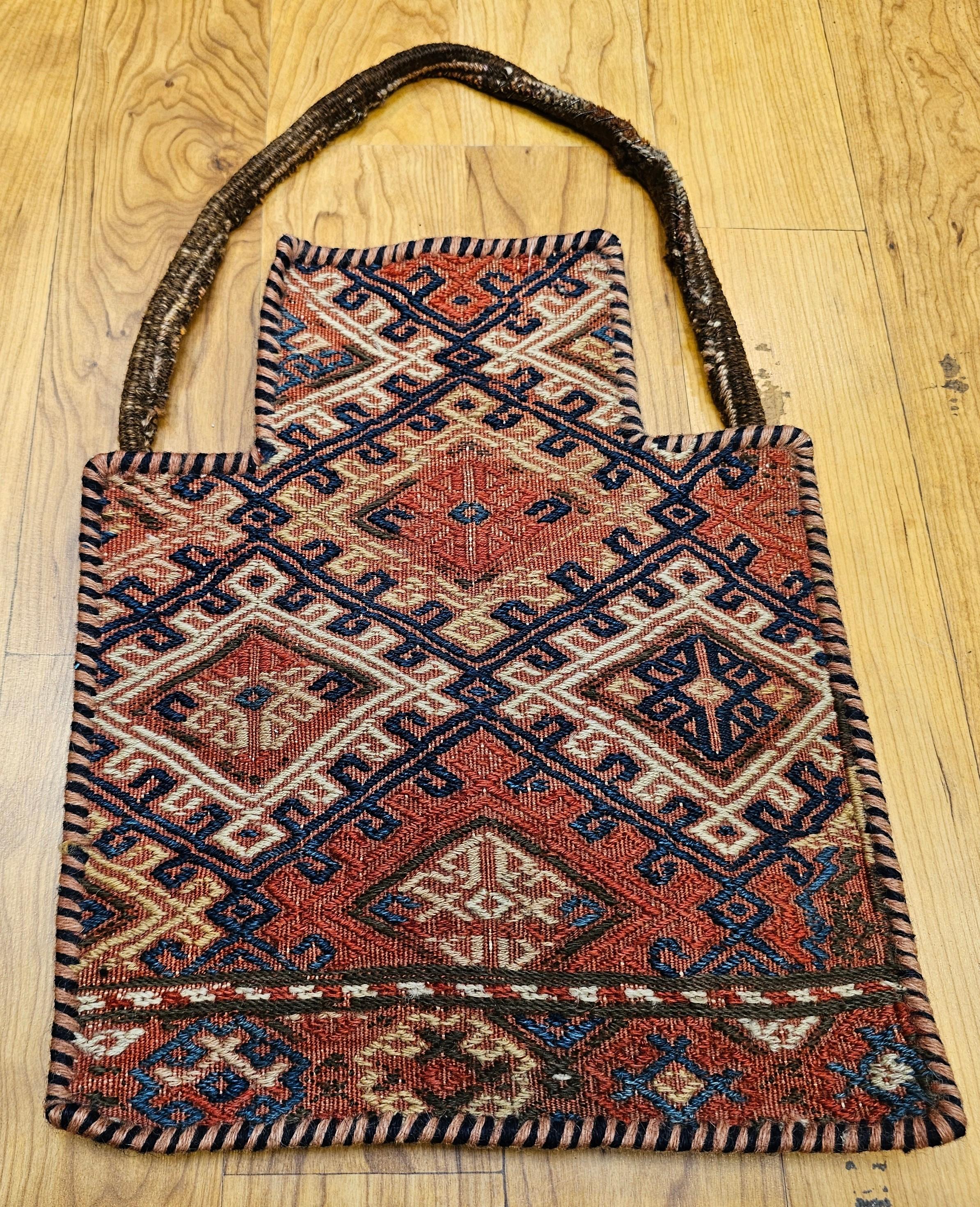 Discover a captivating piece of nomadic heritage with this Vintage Persian Baluch Tribal Salt Bag, now beautifully repurposed as unique tribal wall art. This extraordinary textile, a functional yet artistic creation, features a distinctive geometric