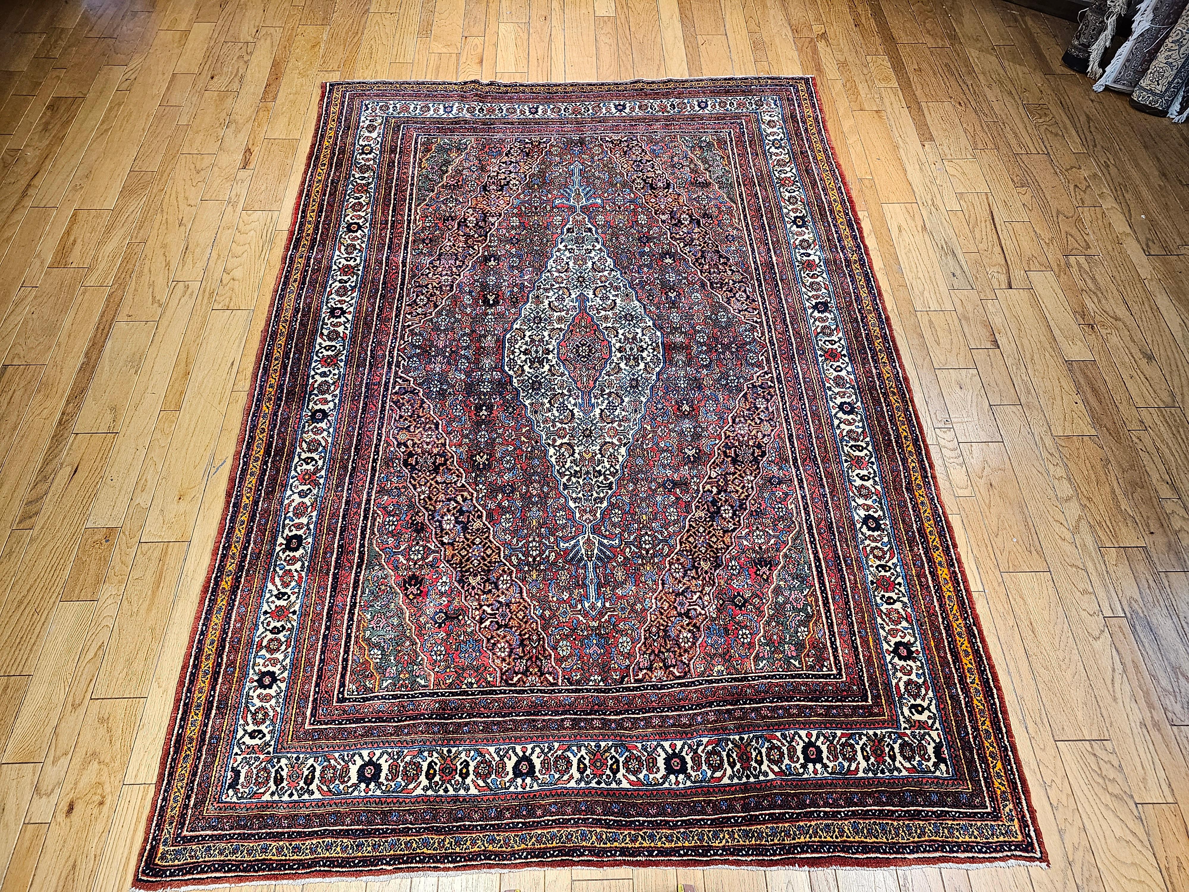 An exceptional vintage Persian Bibikabad rug from the early 20th century, showcasing the traditional Herati pattern with signature Bibikabad elements and a rich, vibrant palette. This handwoven tribal piece features a striking elongated ivory