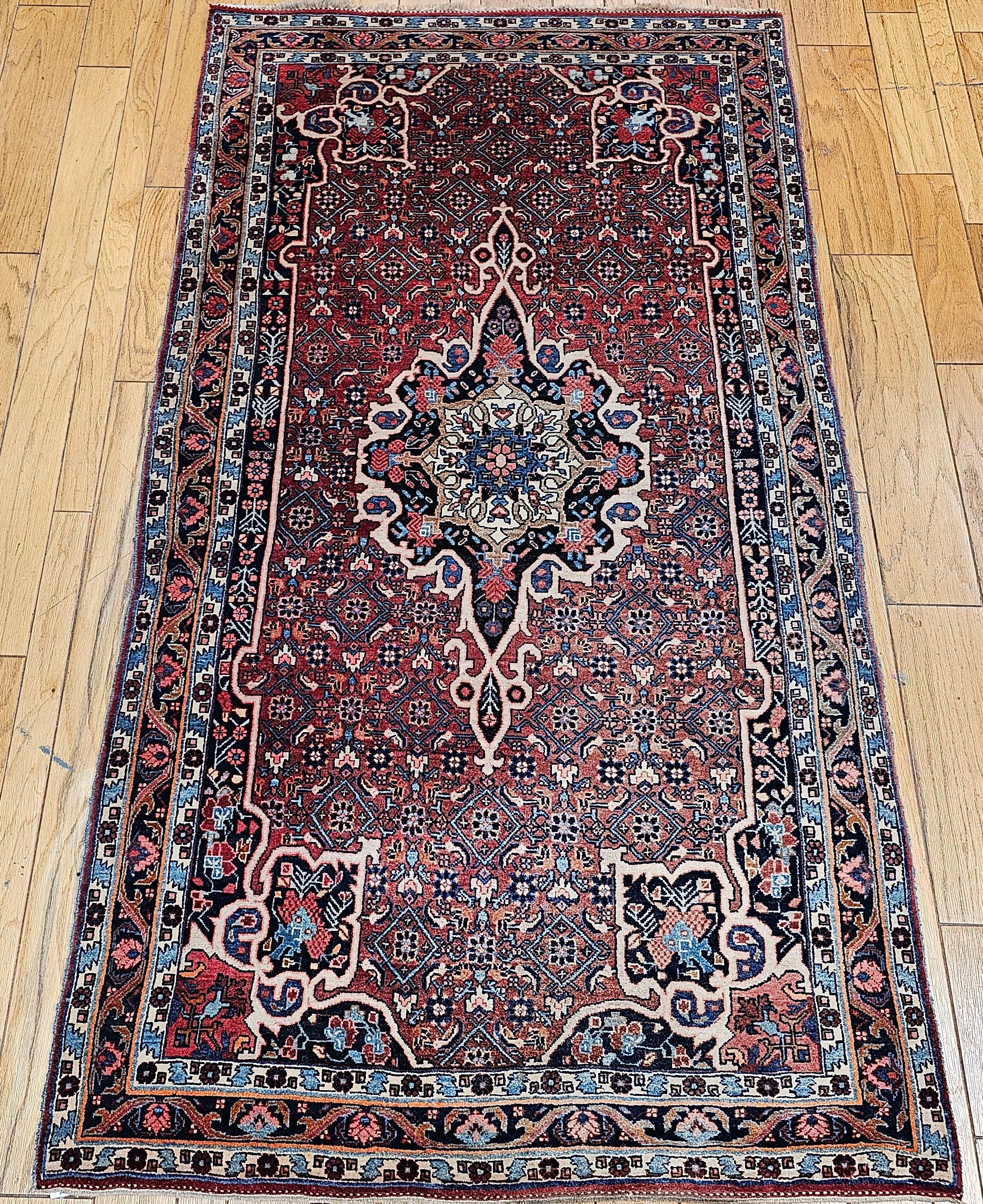  Vintage Persian Bidjar (Bijar) gallery (corridor) rug in a medallion floral pattern was woven in the early 1900s.  The Bidjar (Bijar) rug has a red or rust color field with a Herati geometric design.  The field design accent colors include green,