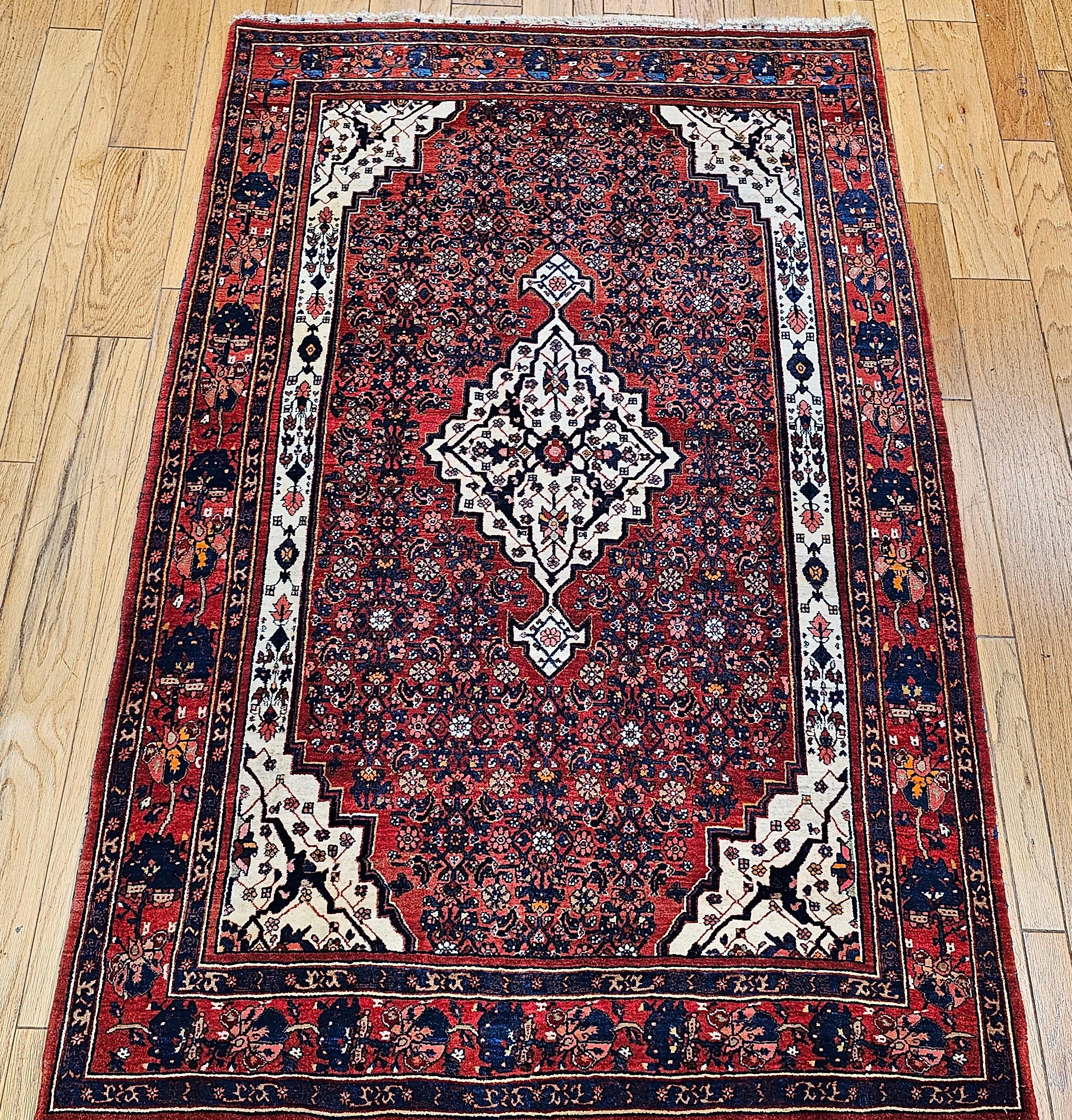 Vintage Persian Bidjar area rug from the early 20th century in a medallion pattern set on a Herati field design.   The Bidjar rug has a central medallion and corner spandrels in a brilliant white color which makes the design stand out. The use of