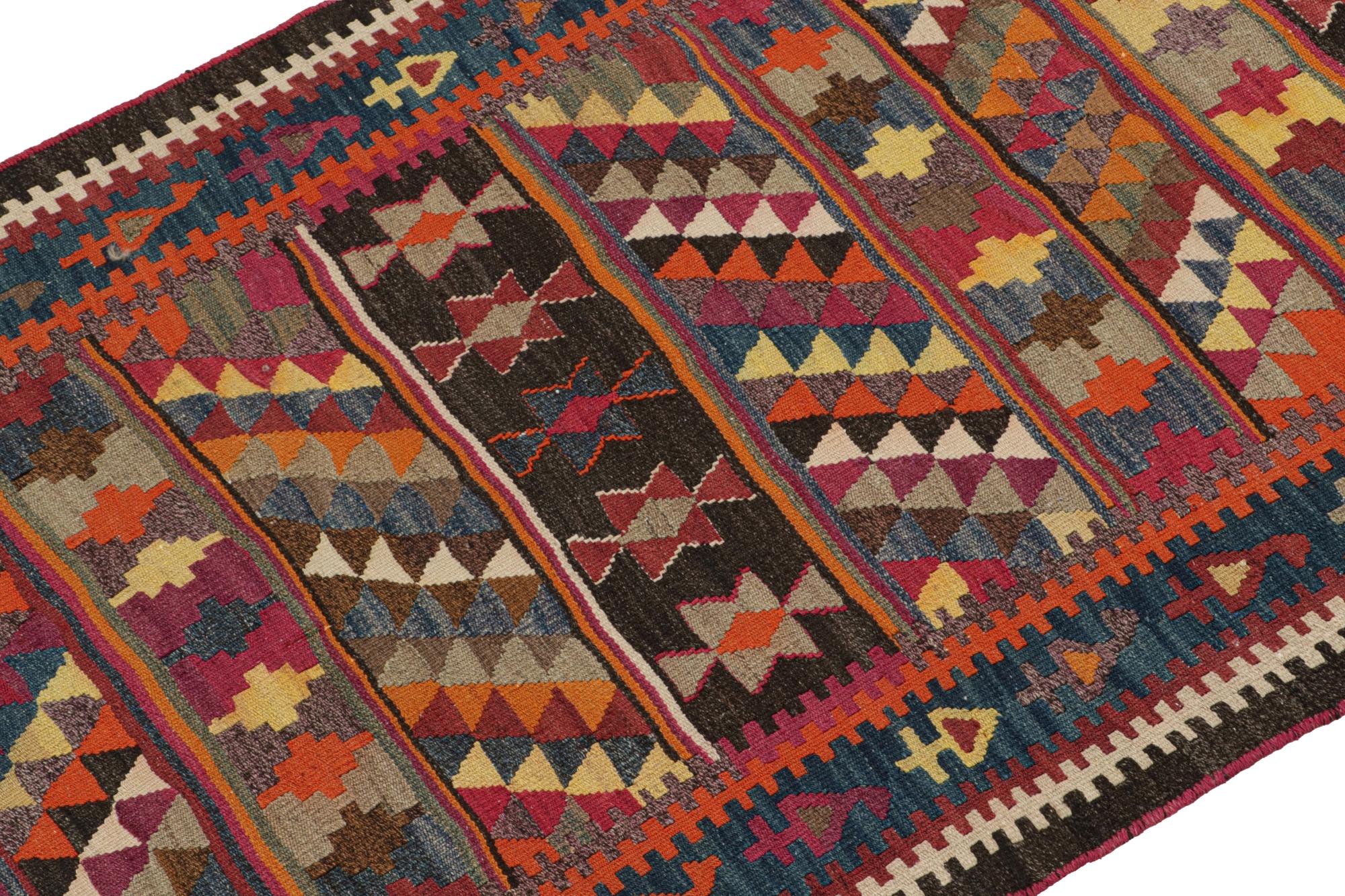 This vintage 4x8 Persian Bidjar kilim is handwoven in wool, and originates circa 1950-1960. 

Further on the Design:

The rare piece carries polychromatic geometric patterns favoring black, orange, pink & yellow. Connoisseurs may admire this