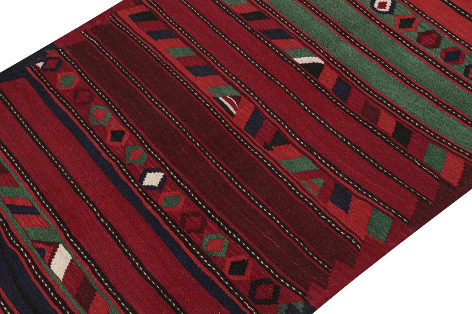 This vintage 6x12 Persian Kilim is a rare midcentury Bidjar tribal rug, handwoven in wool circa 1950-1960.

On the Design: 

This particular Bidjar Kilim marks a creative employ of a minimal palette in its use of reds, blues, and greens. Keen