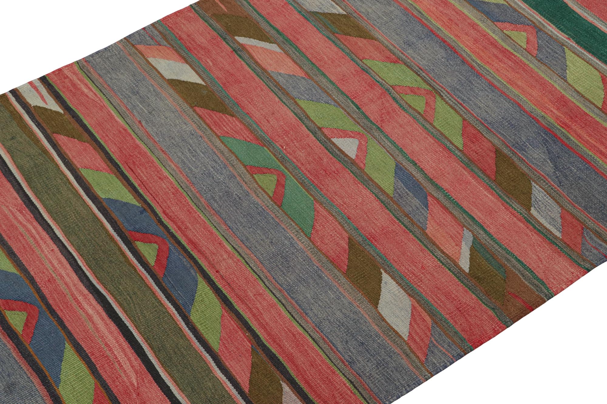 This vintage 5x10 Persian Kilim is a rare Bidjar flatweave and tribal rug, handwoven in wool circa 1950-1960.

On the Design: 

This particular Bidjar Kilim marks a creative employ of a minimal palette in its use of reds, blues, and greens. Keen