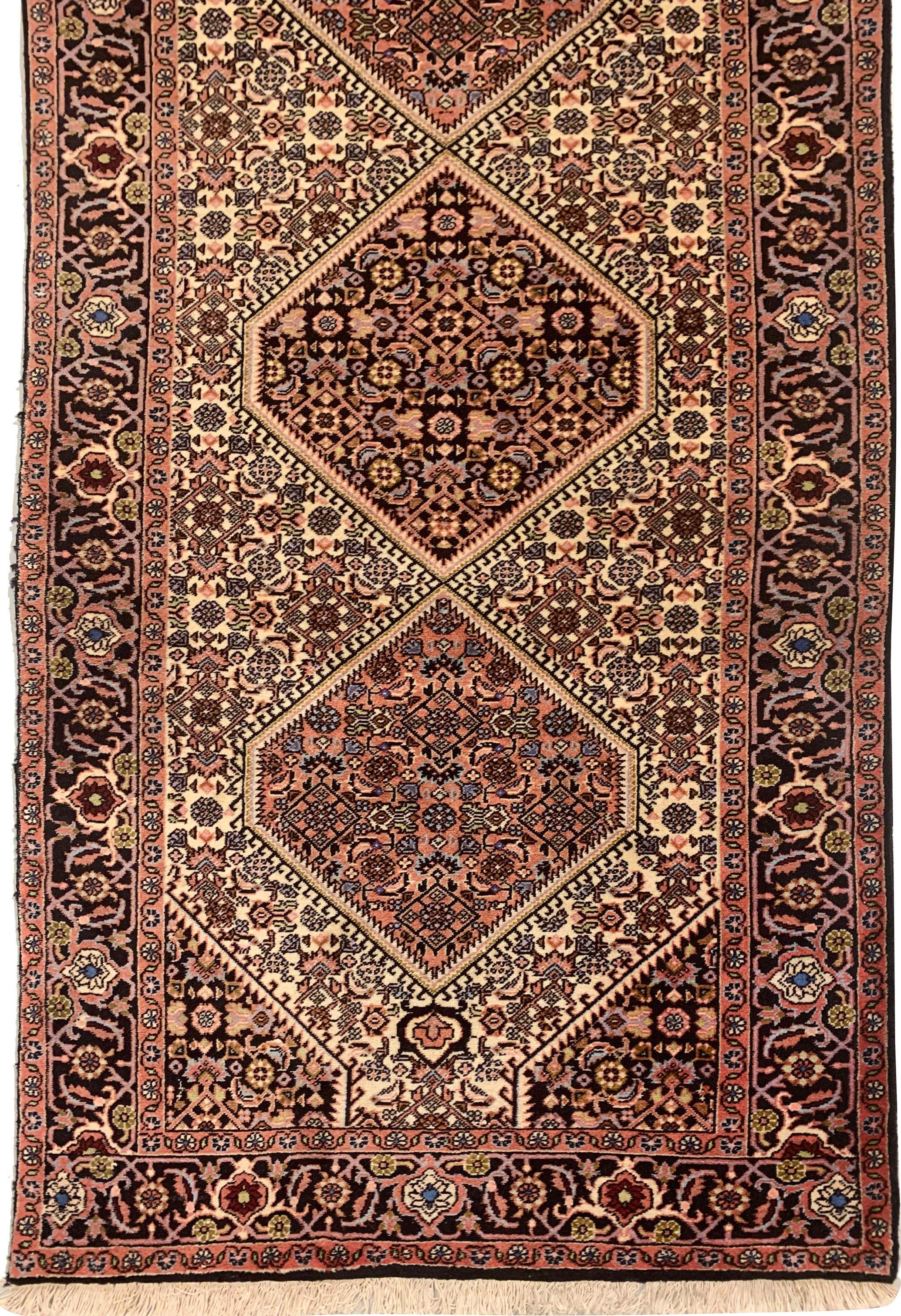 Vintage Persian Bidjar Runner Rug 2'7 X 9'9. A hand-knotted wool vintage Persian runner with a traditional design that works well in both a modern or conventional room setting. Color: ivory/ blue/ brick red