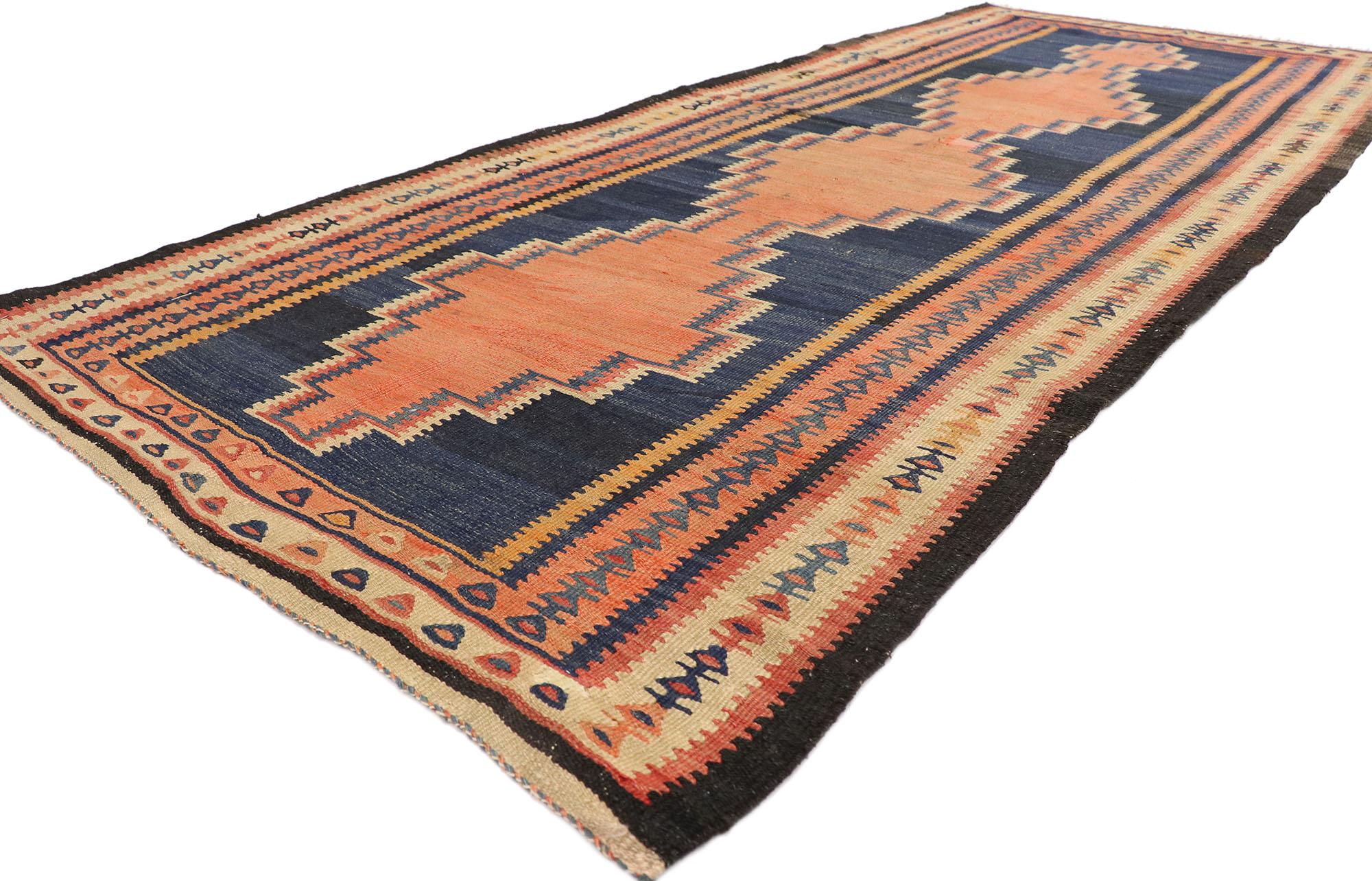 77942 Vintage Persian Bijar Kilim Rug, 04'01 x 09'07.
Embark on a captivating journey where nomadic charm gracefully converges with tribal enchantment in our handwoven wool vintage Persian Bijar kilim rug. Rooted in tradition, this flatweave rug