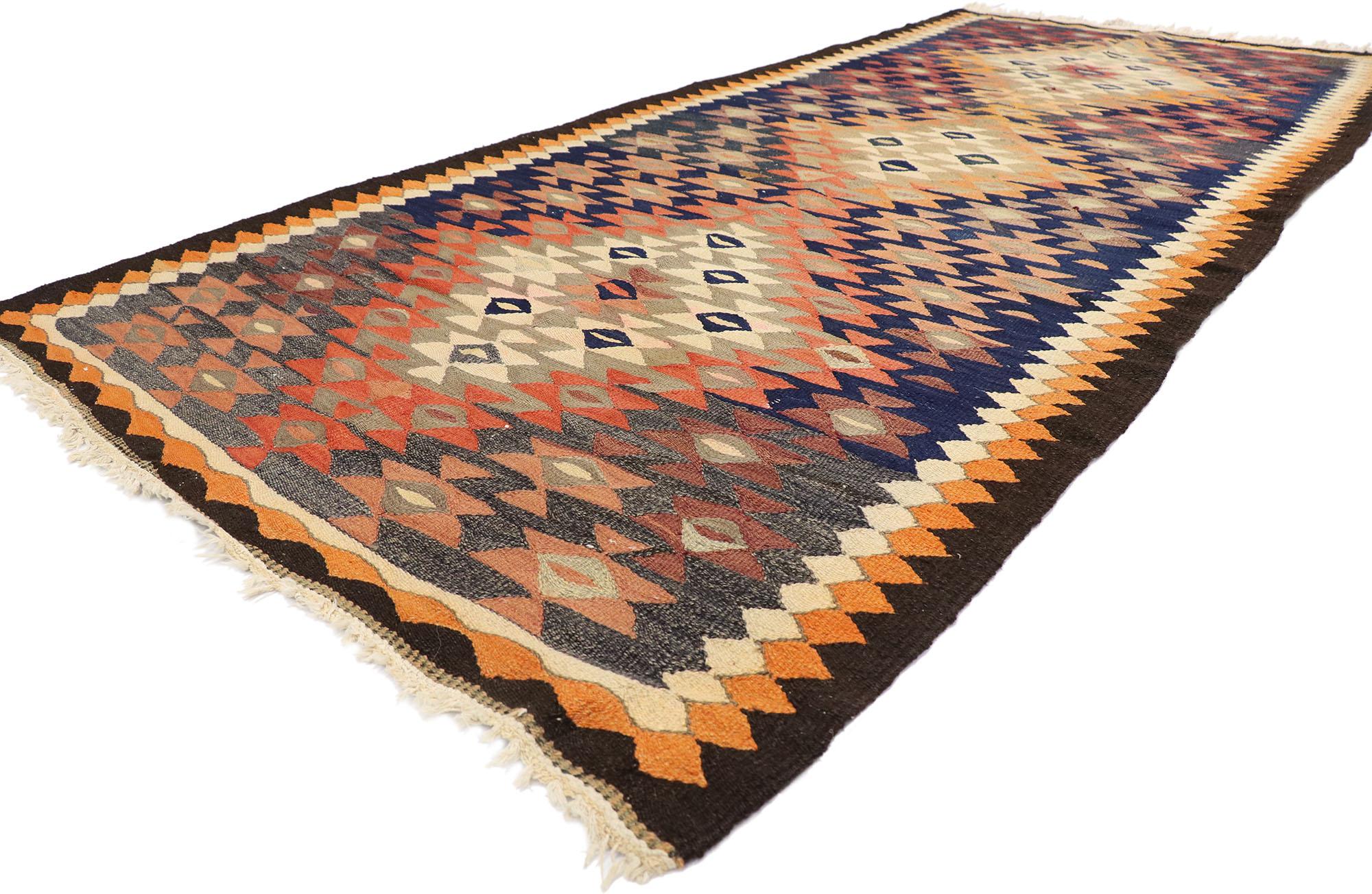 78015 Vintage Persian Bijar Kilim Rug, 04'04 x 09'07.
Embark on a captivating journey where tribal enchantment gracefully converges with modern desert chic in our handwoven wool vintage Persian Bijar kilim rug. Rooted in tradition, this flatweave