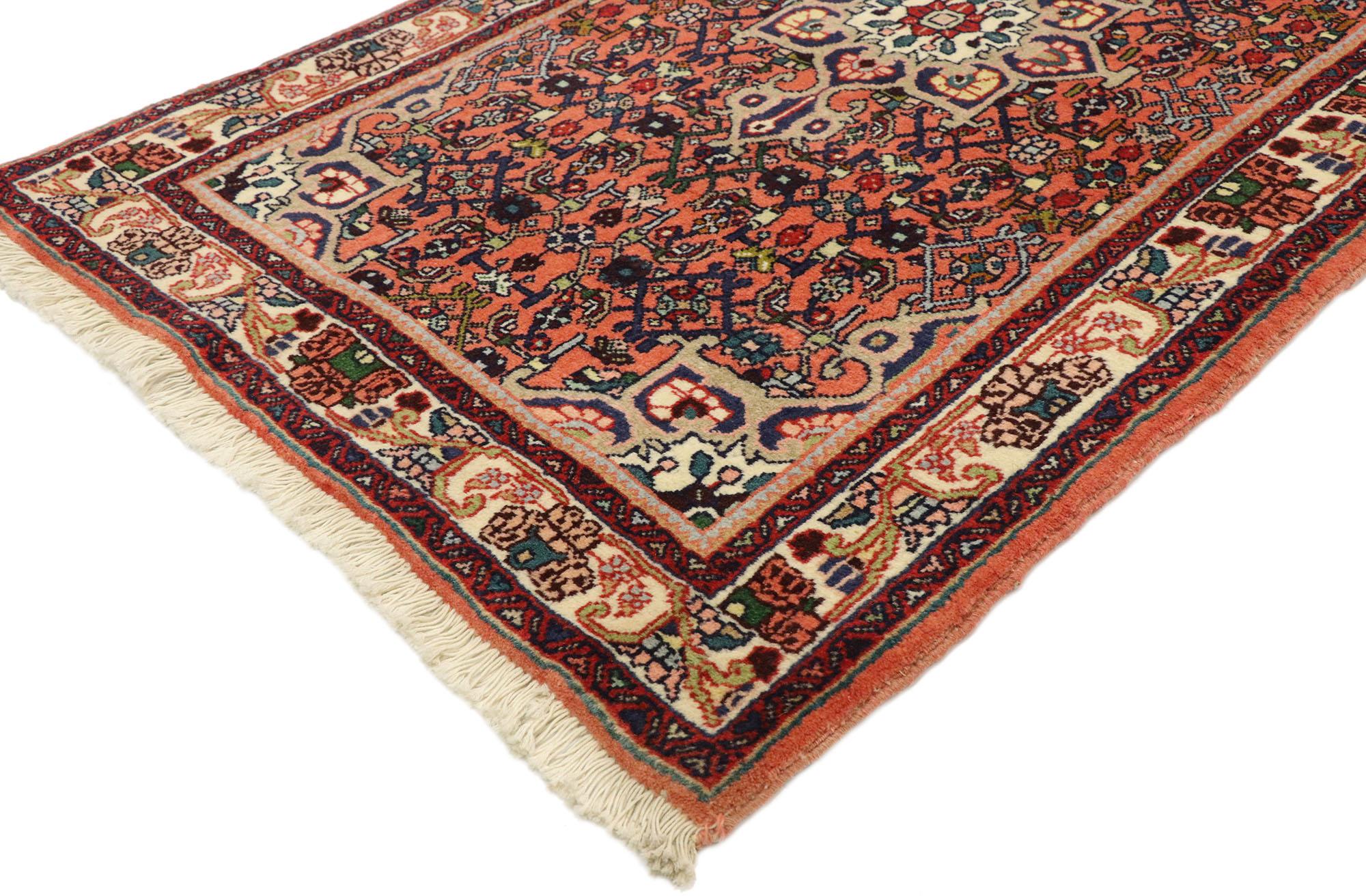 76056 Vintage Persian Bijar Rug, 02'06 x 04'00. Crafted with meticulous care and timeless artistry, this hand-knotted wool Persian Bijar rug boasts a round floral medallion as its centerpiece, exuding a sense of understated elegance and grace.
