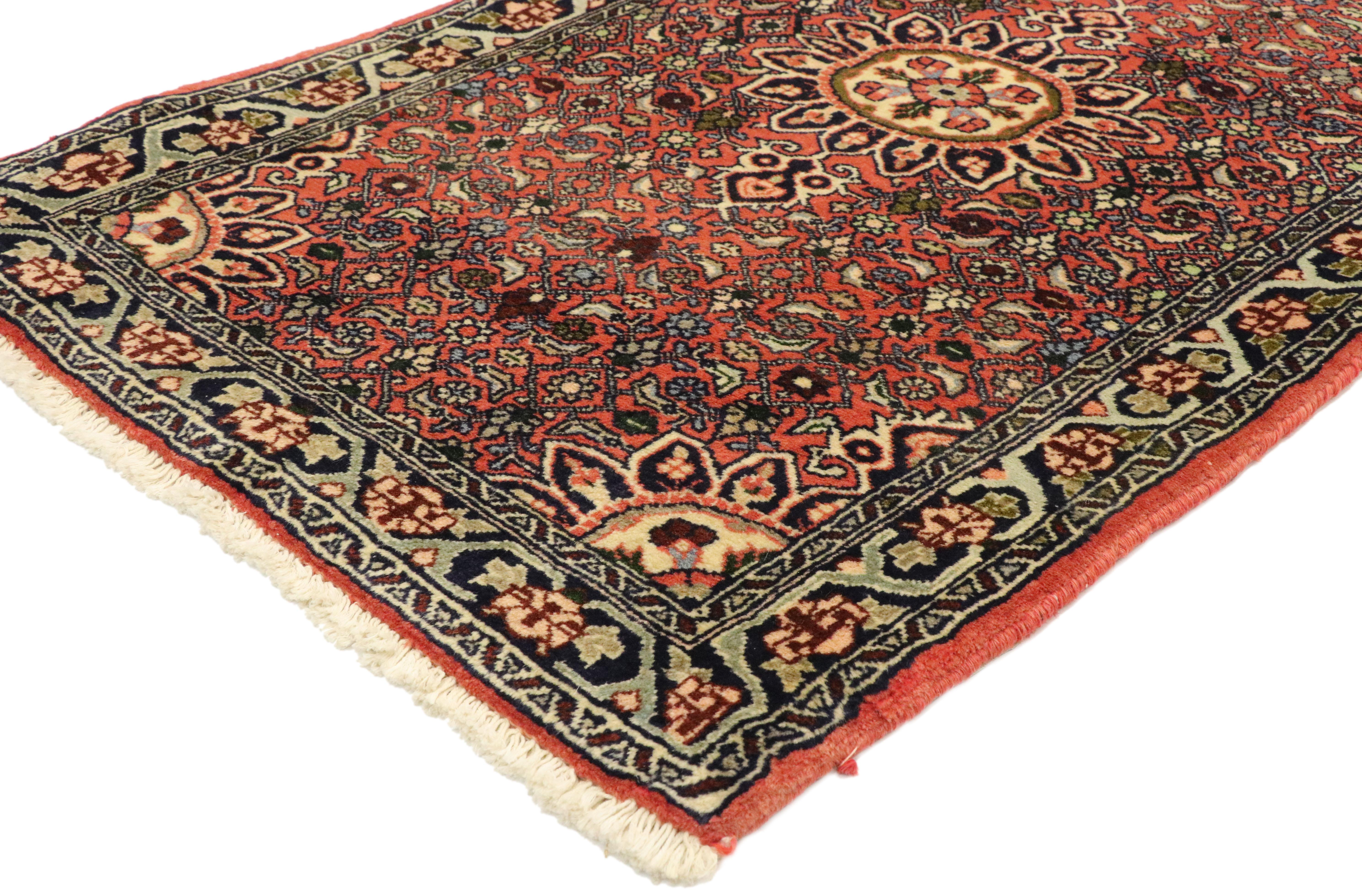 76054, vintage Persian Bijar Scatter rug with Traditional Modern style, accent rug. This Persian Bijar rug features a round floral medallion and bright, dense patterning throughout. A dainty pink floral border surrounds. Bijar rugs are versatile and