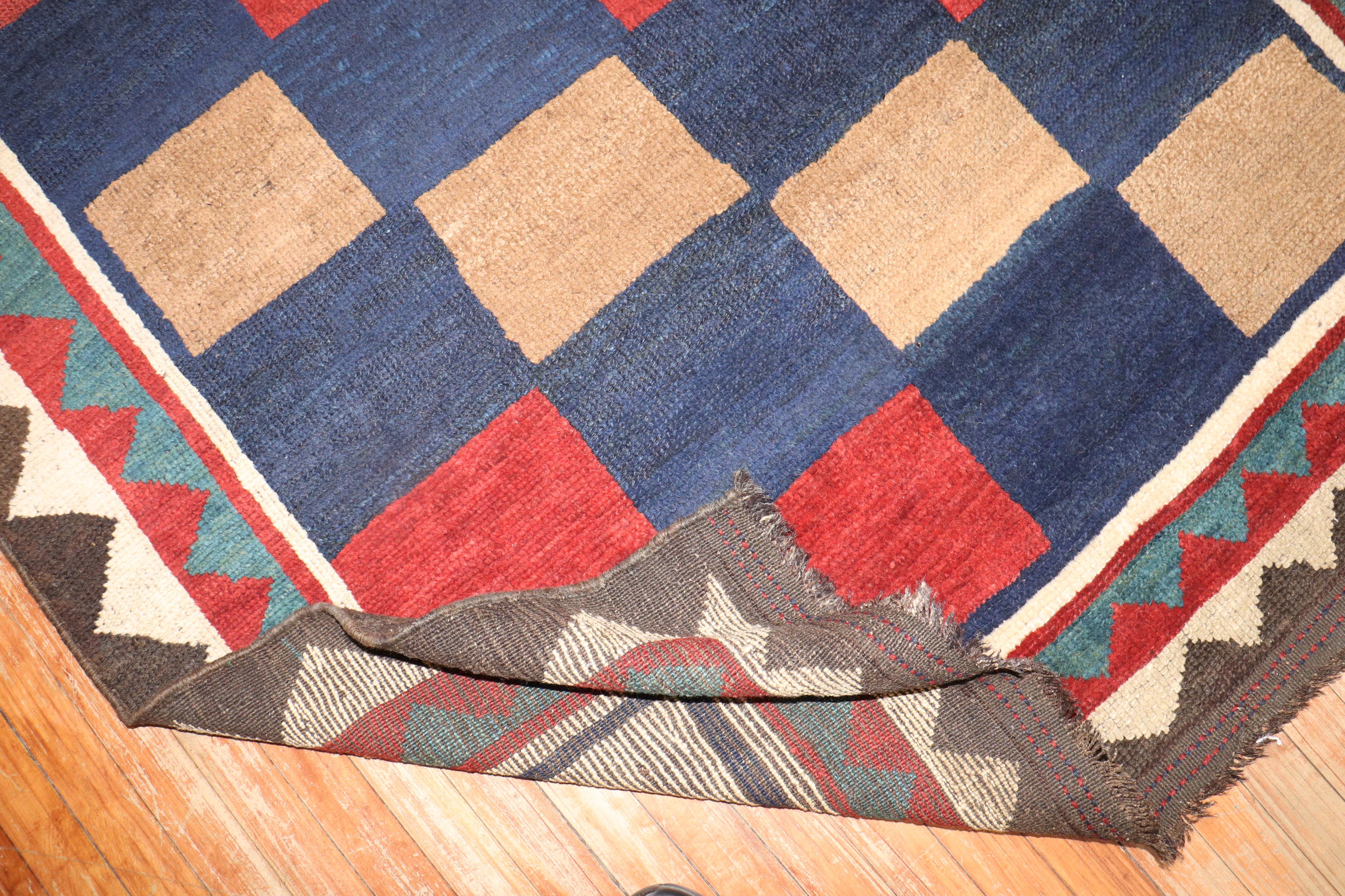 Mid-20th century Persian Gabbeh rug with an all-over repetitive box shape pattern

Measures: 4.11' x 7'.