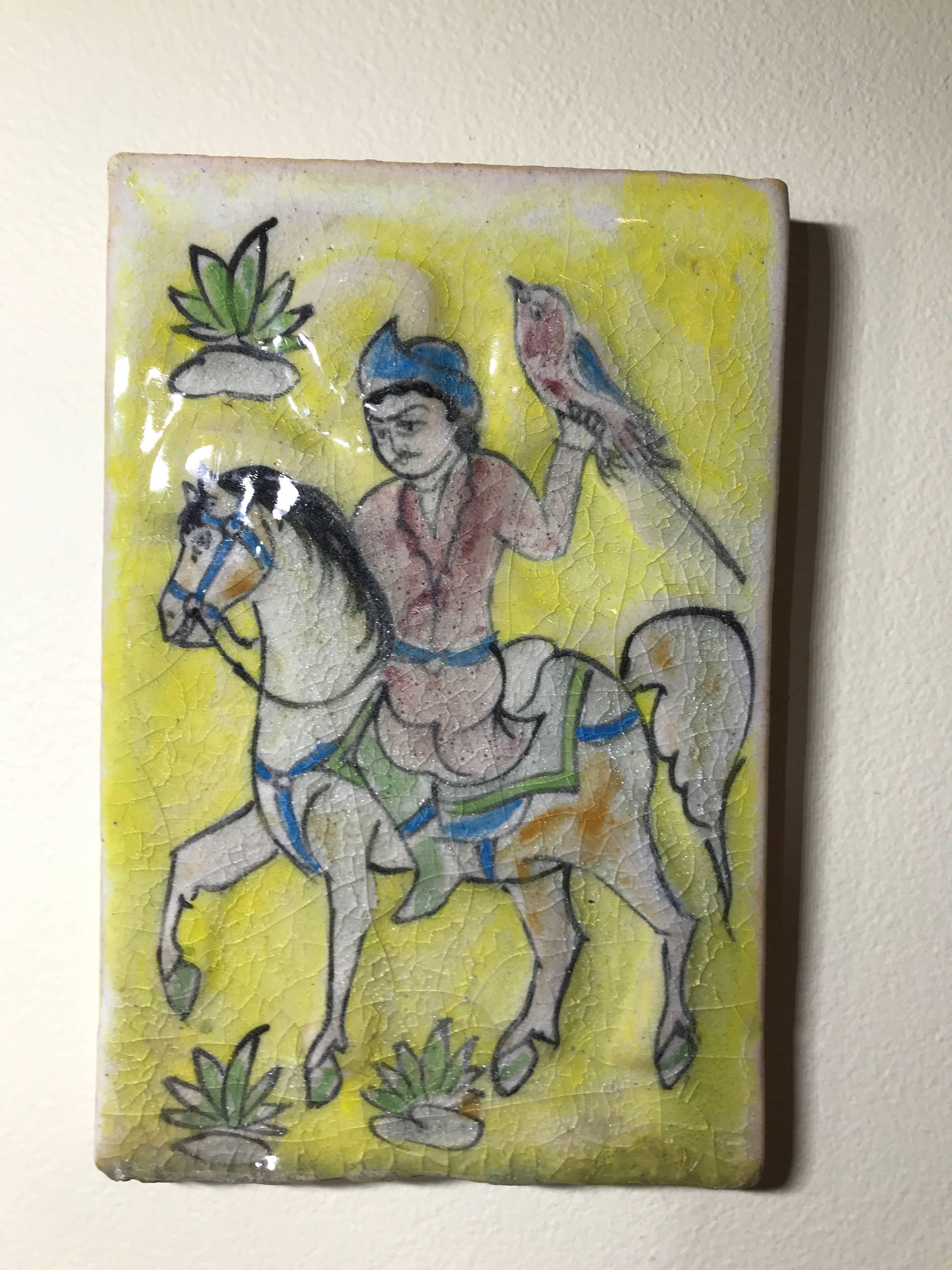Beautiful ceramic tile hand-painted and glazed of a hunter riding on horse holding bird .great decorative tile to hang on the wall.
 