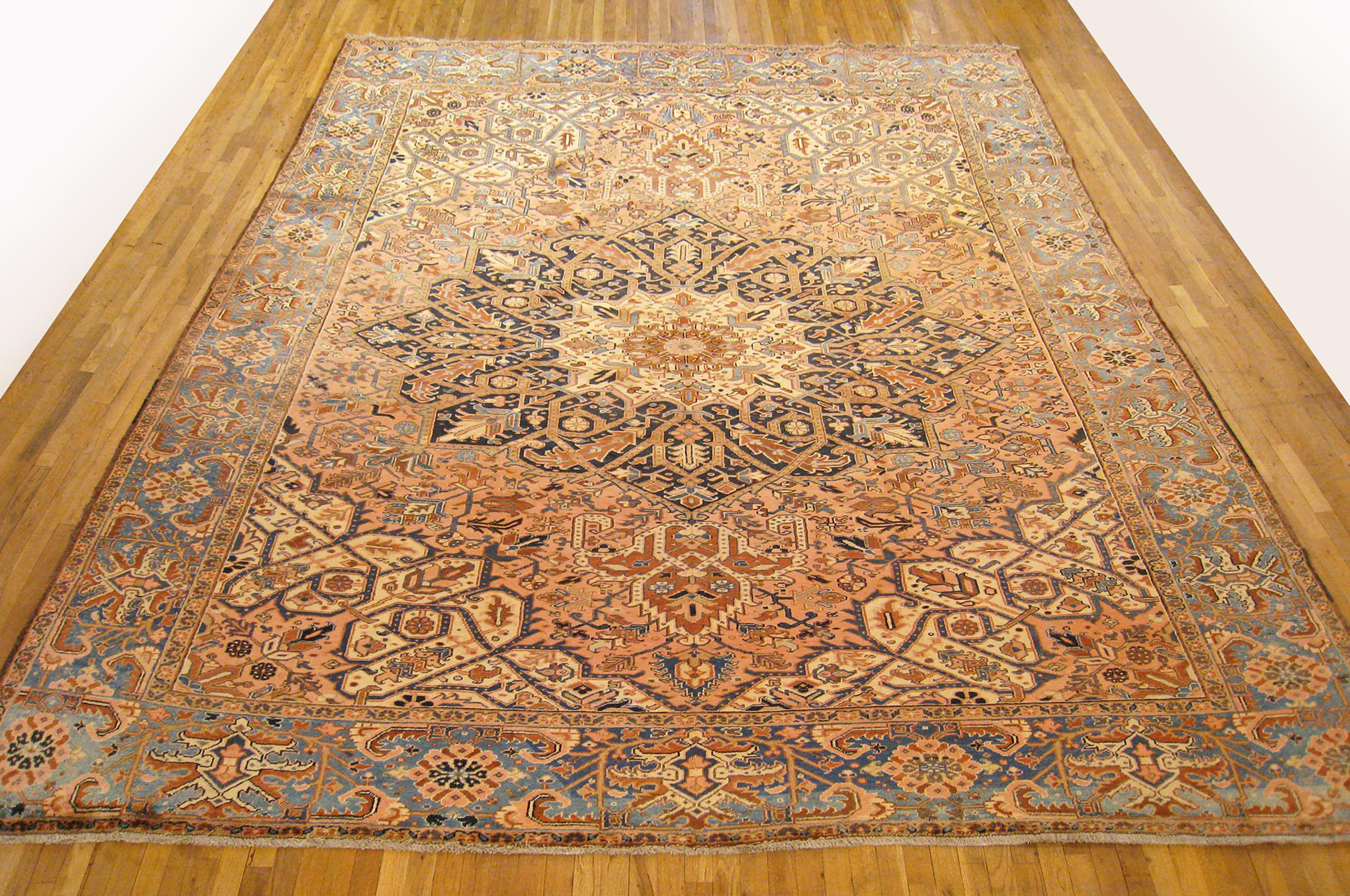 Vintage Persian Heriz Oriental rug, Large size.

A vintage Persian Heriz oriental rug, size 14'8
