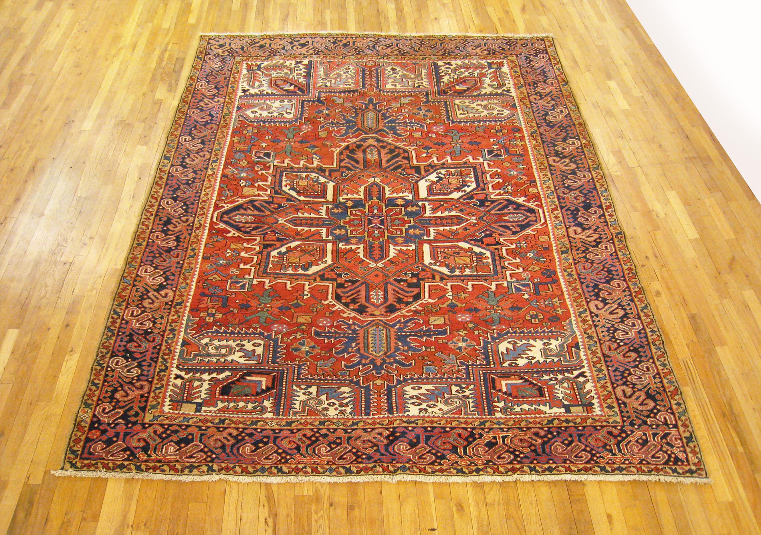 Vintage Persian Heriz Oriental rug, room size

A vintage Persian Heriz oriental rug, size 10'6