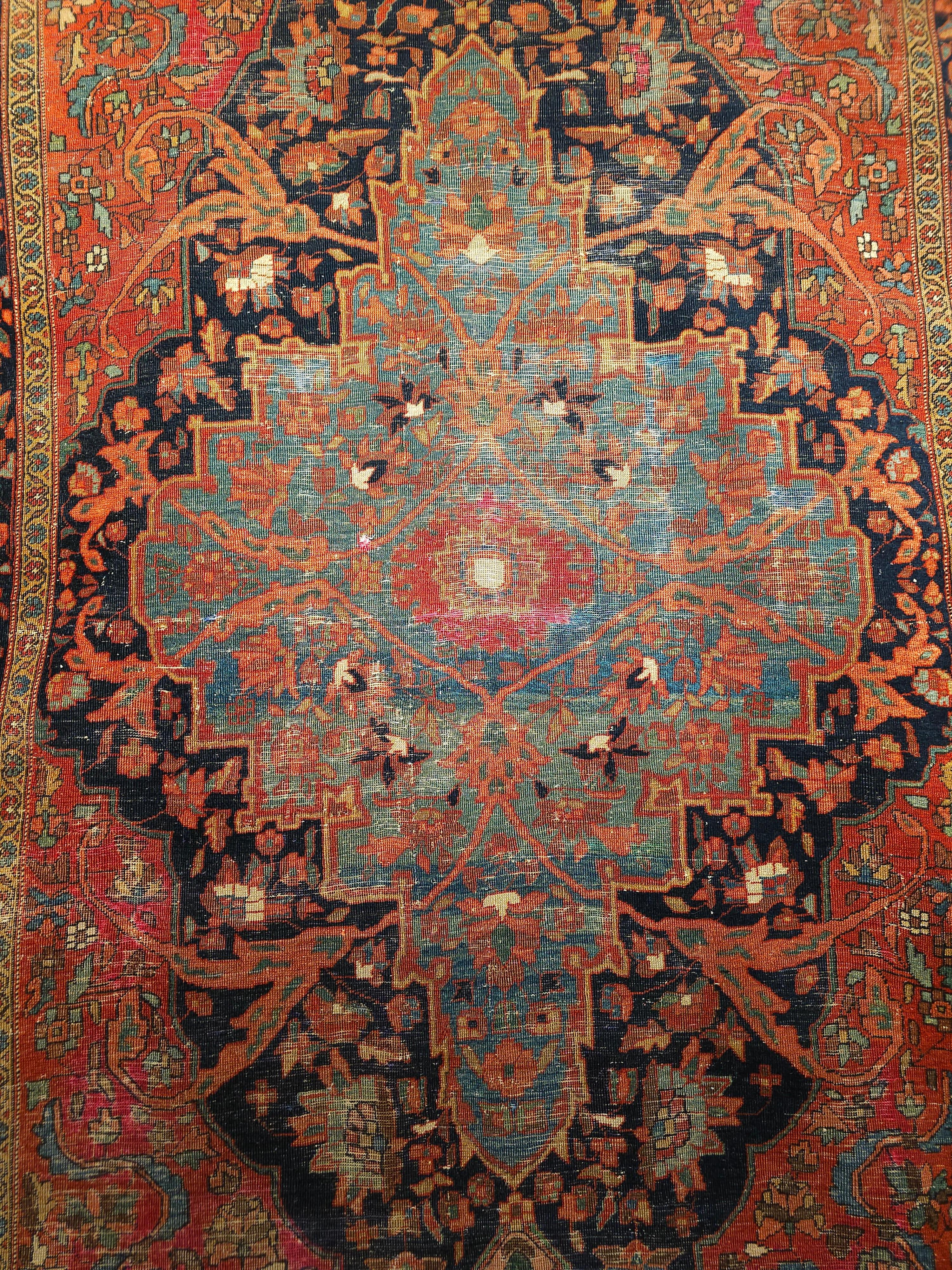 Vintage Persian Farahan with a Botanical Design in Abrash Pale Blue/Green, Navy Blue, and Red. One of the most beautiful Persian Farahan area rugs in our collection. Astonishingly beautiful design and color combination. The central pale-blue