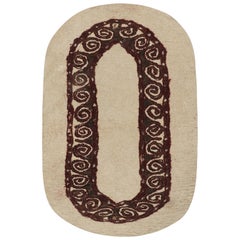 Tappeto ovale persiano vintage in feltro beige con motivo geometrico