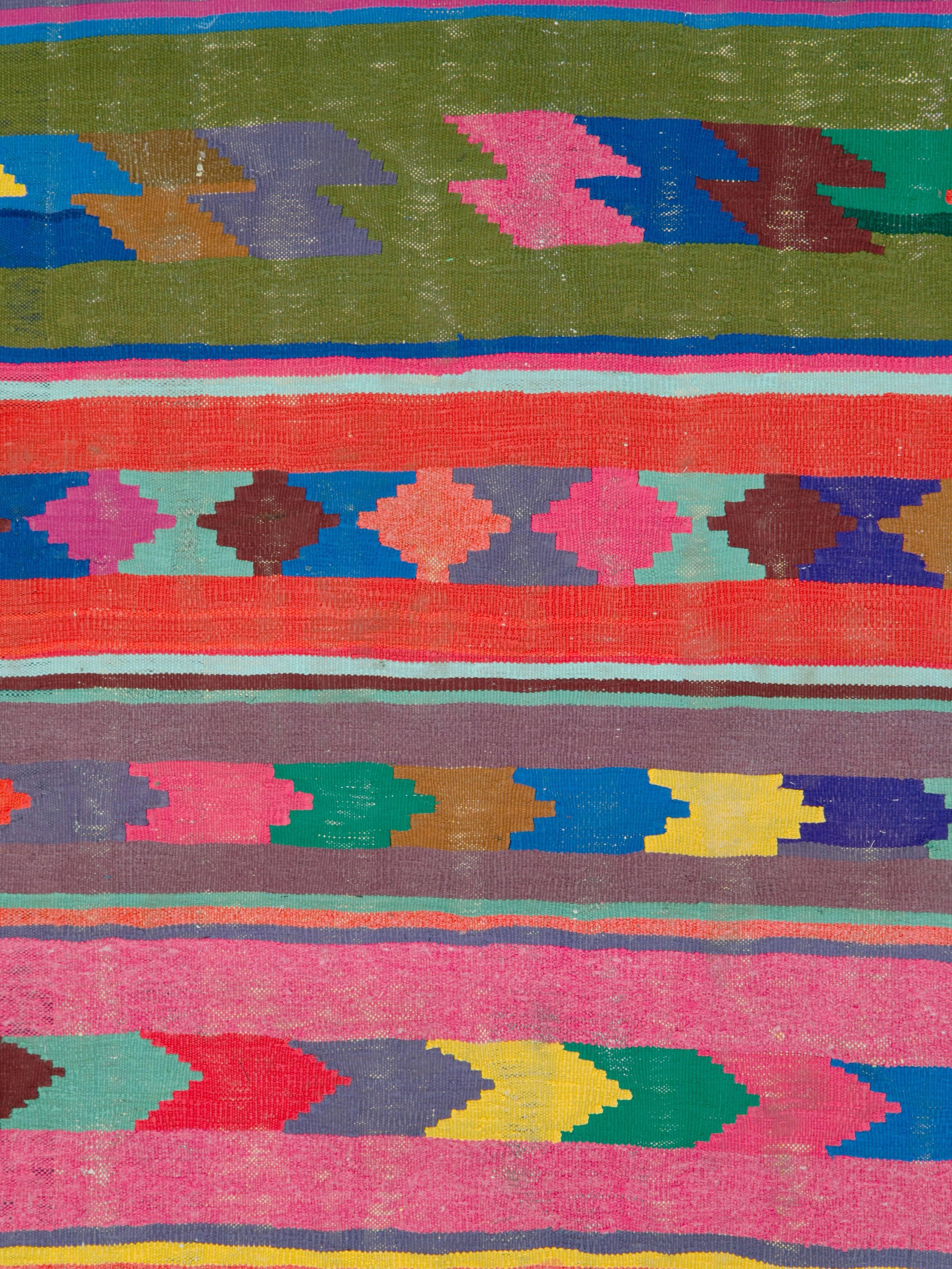 A Persian flat-woven Kilim rug from the late 20th century.