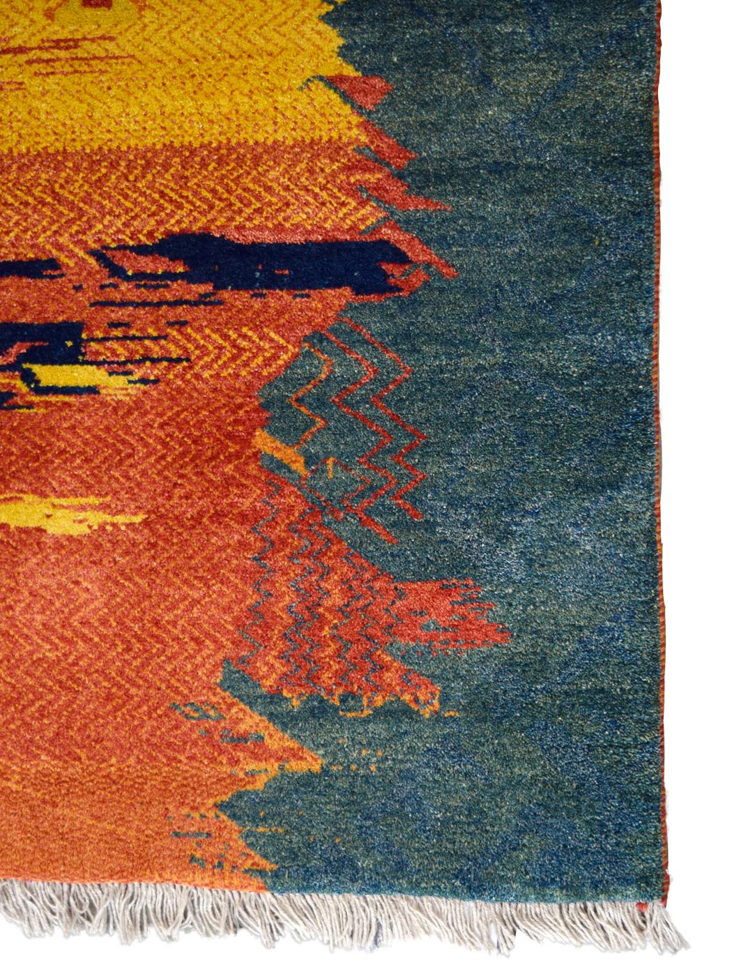 In vibrant hues of red, orange, indigo, green, and gold wool, this vintage carpet employs a unique design rarely created by traditional Gabbeh weavers. This carpet measures 4’x 5’7” and utilizes a thick plush, hand-knotted wool Lorestan weave, and a