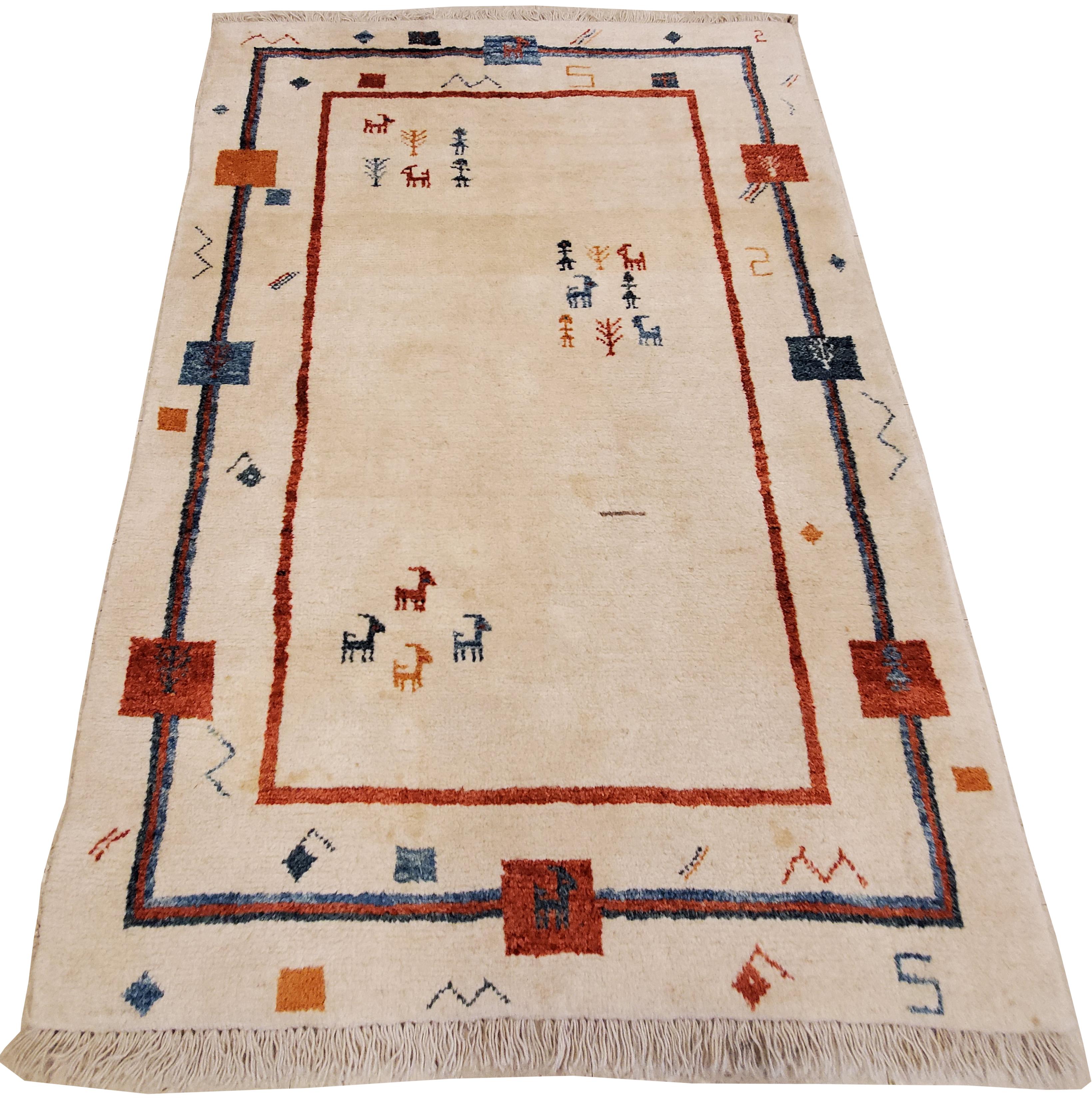 A whimsical vintage Persian Gabbeh rug with an natural creamy ivory/white background and a beautiful open design boarder. Extra high pile wool ornate with characteristic designs.