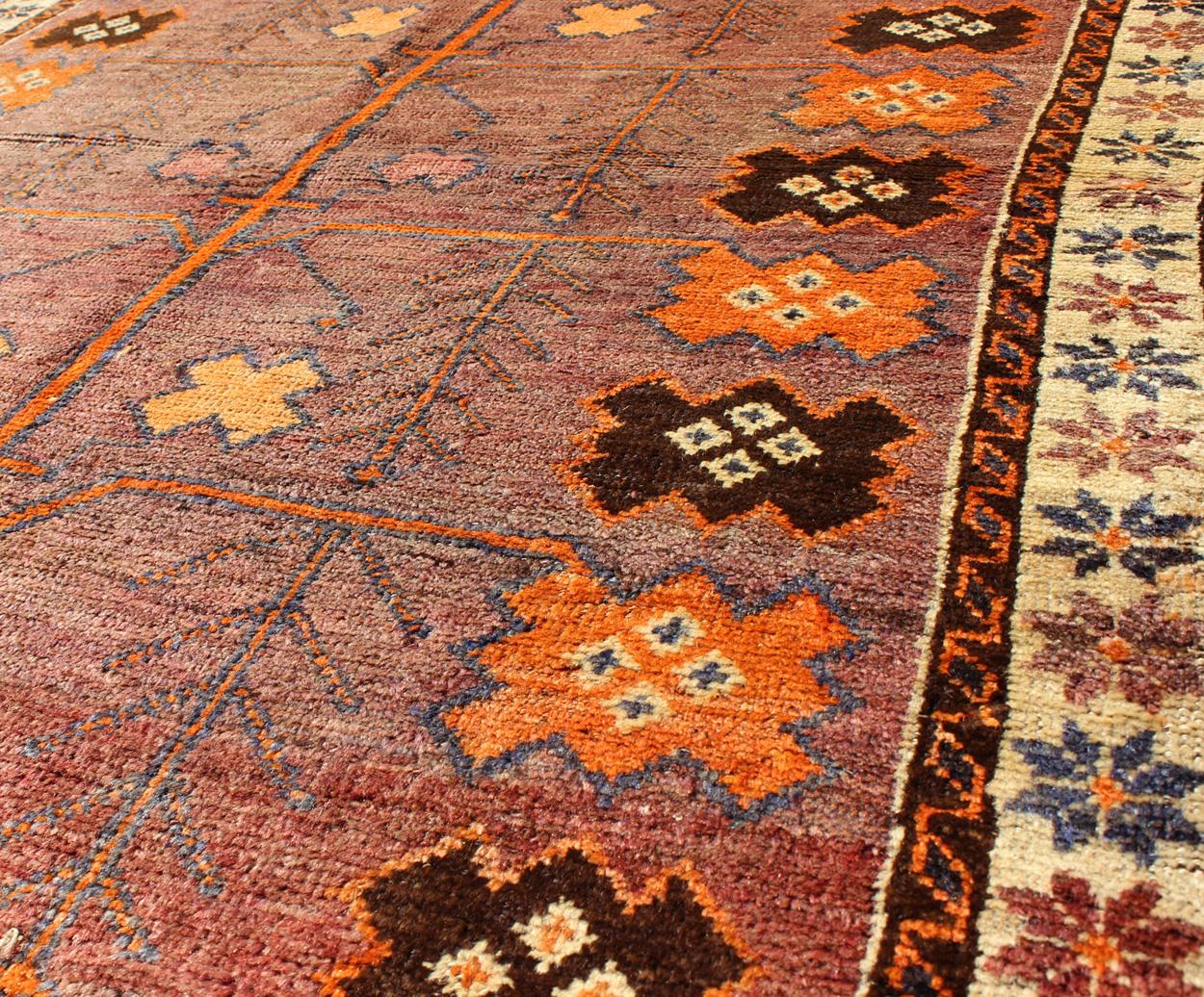 Mid-20th Century Vintage Persian Gabbeh Rug with Variegated Purple Central Field & Tribal Motifs