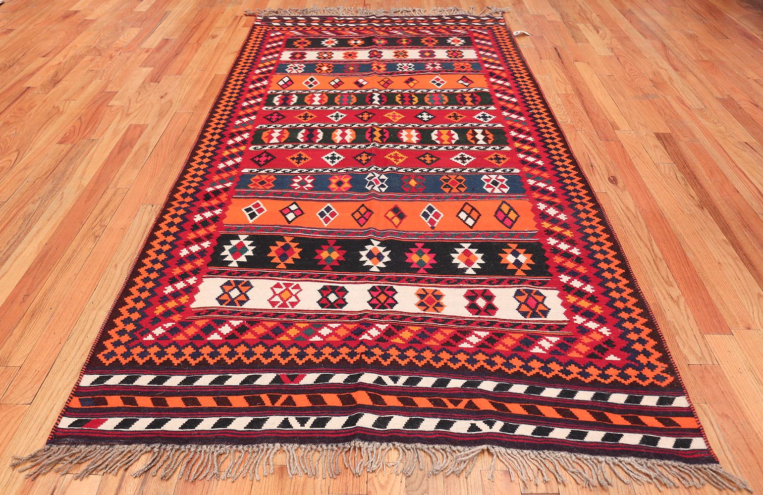 Vintage Ghashgai rug, Origin: Persia, circa mid-20th century. Size: 5 ft x 9 ft (1.52 m x 2.74 m)

A vibrant display of colors and patterns in this rug establishes a work of art that defies definition. Through this elegant medium, the artist creates