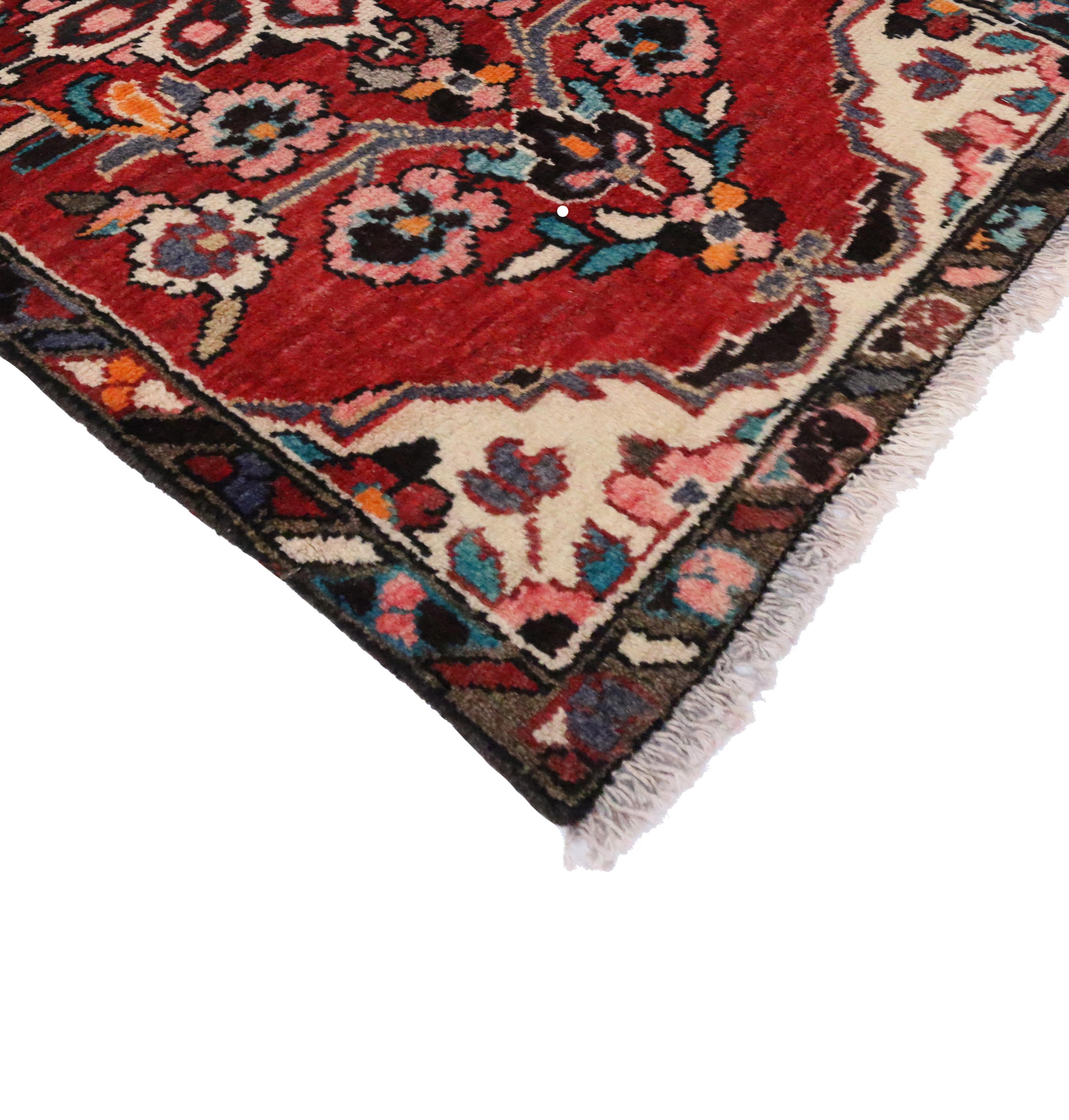 76206, vintage Persian Hamadan Accent rug, small Persian rug. This hand-knotted wool vintage Persian Hamadan accent rug features a stylized and colorful floral design on an abrashed scarlet red field. It is enclosed by ivory spandrels and a charcoal