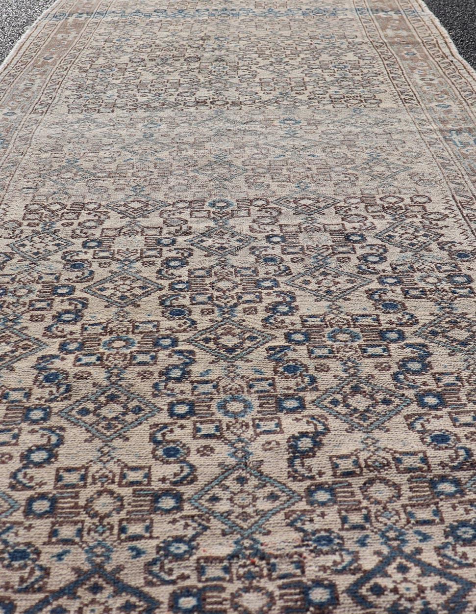 Vintage Persian Hamadan Runner in Cool Tones of Light Blue, Ivory, and L. Brown. Country of Origin: Iran; Type: Hamedan; Design: Floral, Persian Floral, All-Over; Keivan Woven Arts: rug MSE-1944. 
Measures: 3'7 x 9'8
This vintage Persian runner