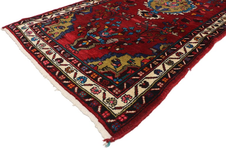 60184 Vintage Persian Hamadan Runner with Jacobean Style, Hallway Runner. Hand-knotted wool vintage Persian Hamadan carpet runner featuring an all-over geometric design on a saturated red field enclosed by three small borders. Showcasing three