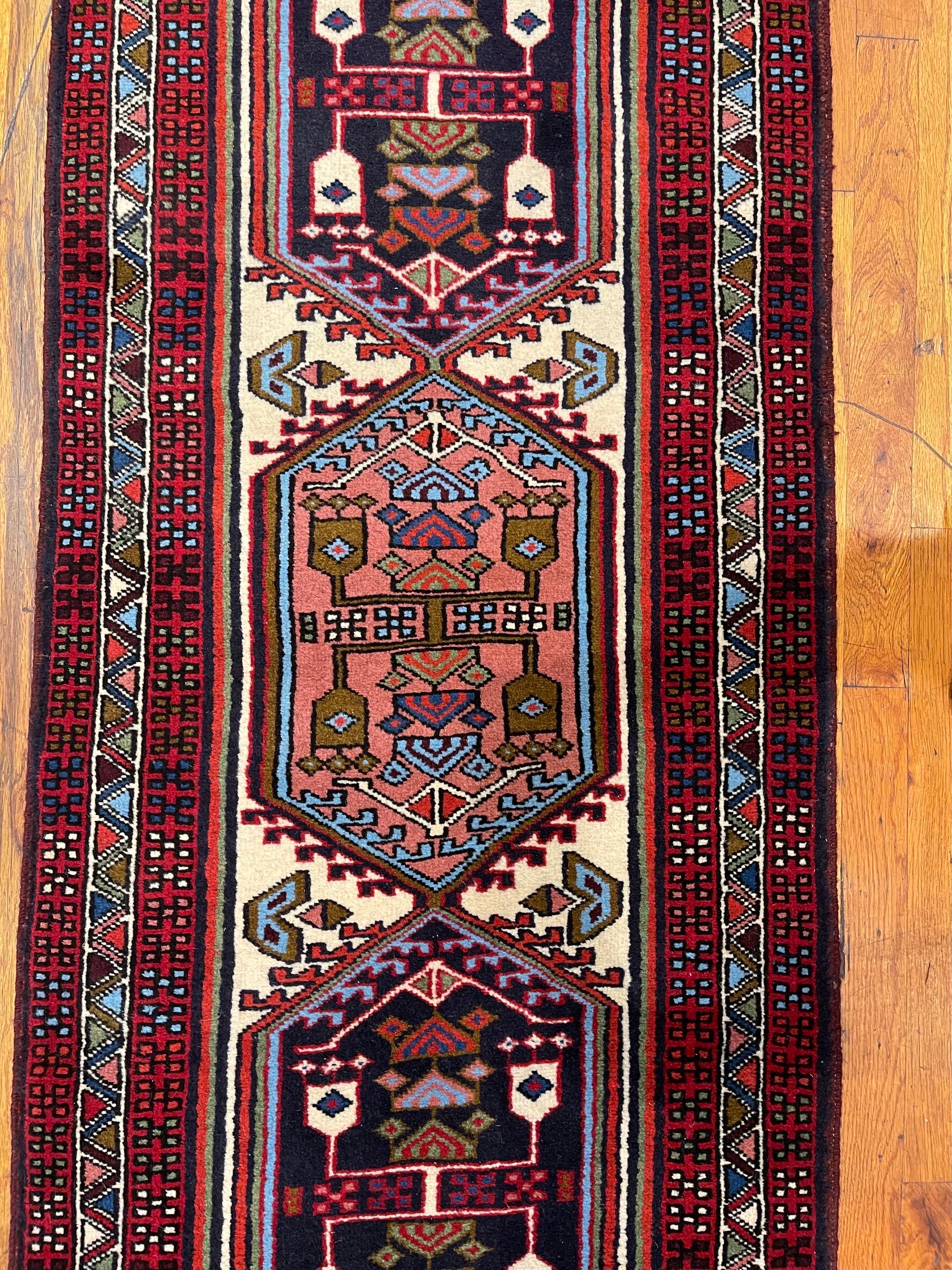 This runner is knotted in the province of Azarbayjan in north-west of Iran. This city is perhaps as ancient rug weaving tradition as is the entire rug history. The design in this piece is geometric with repeated medallion and tribal motifs inspired