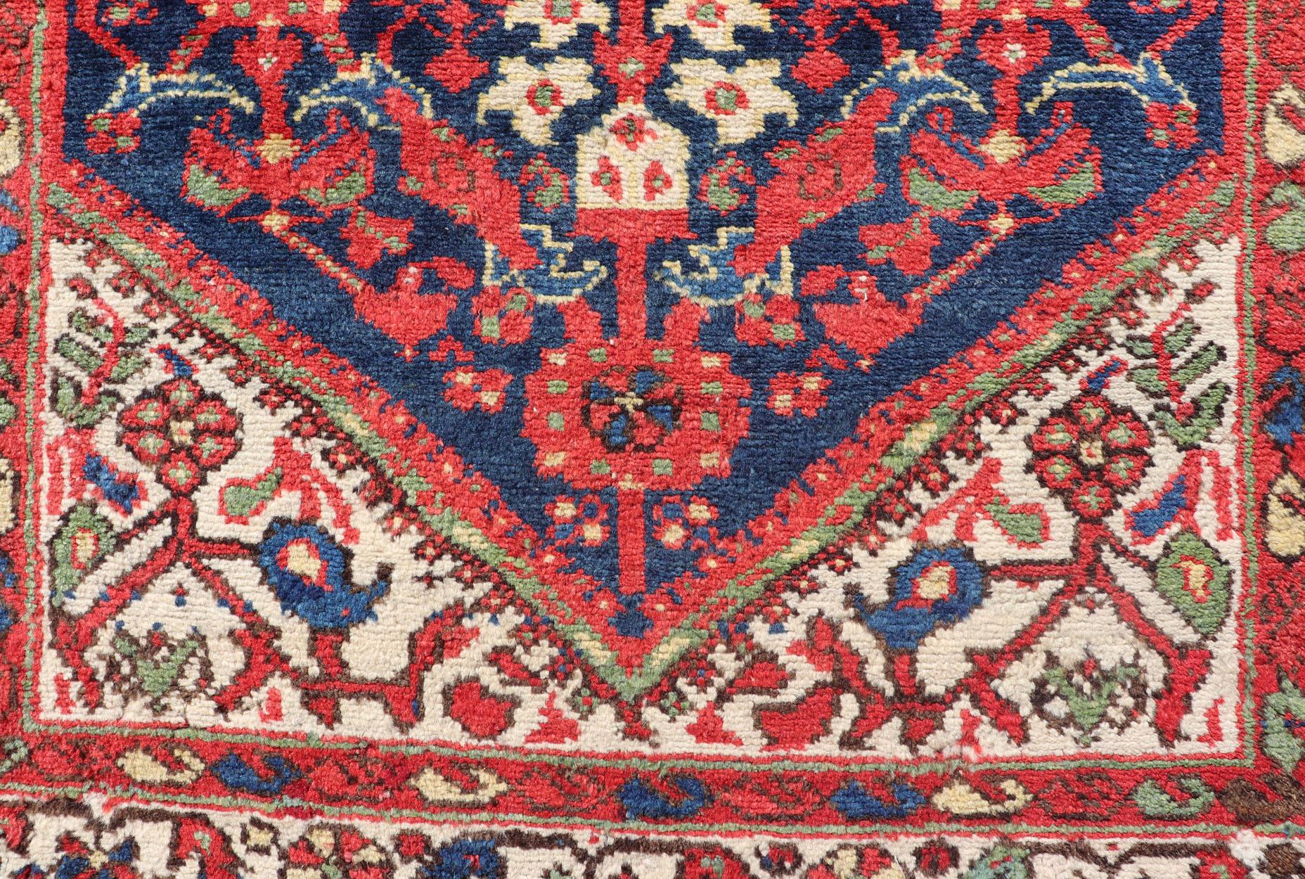 Malayer antique runner from Persia with geometric floral central field design, Keivan Woven Arts/ rug/ PTA-21003, country of origin / type: Iran / Malayer, circa 1930.
Measures: 3'4 x 12'10.