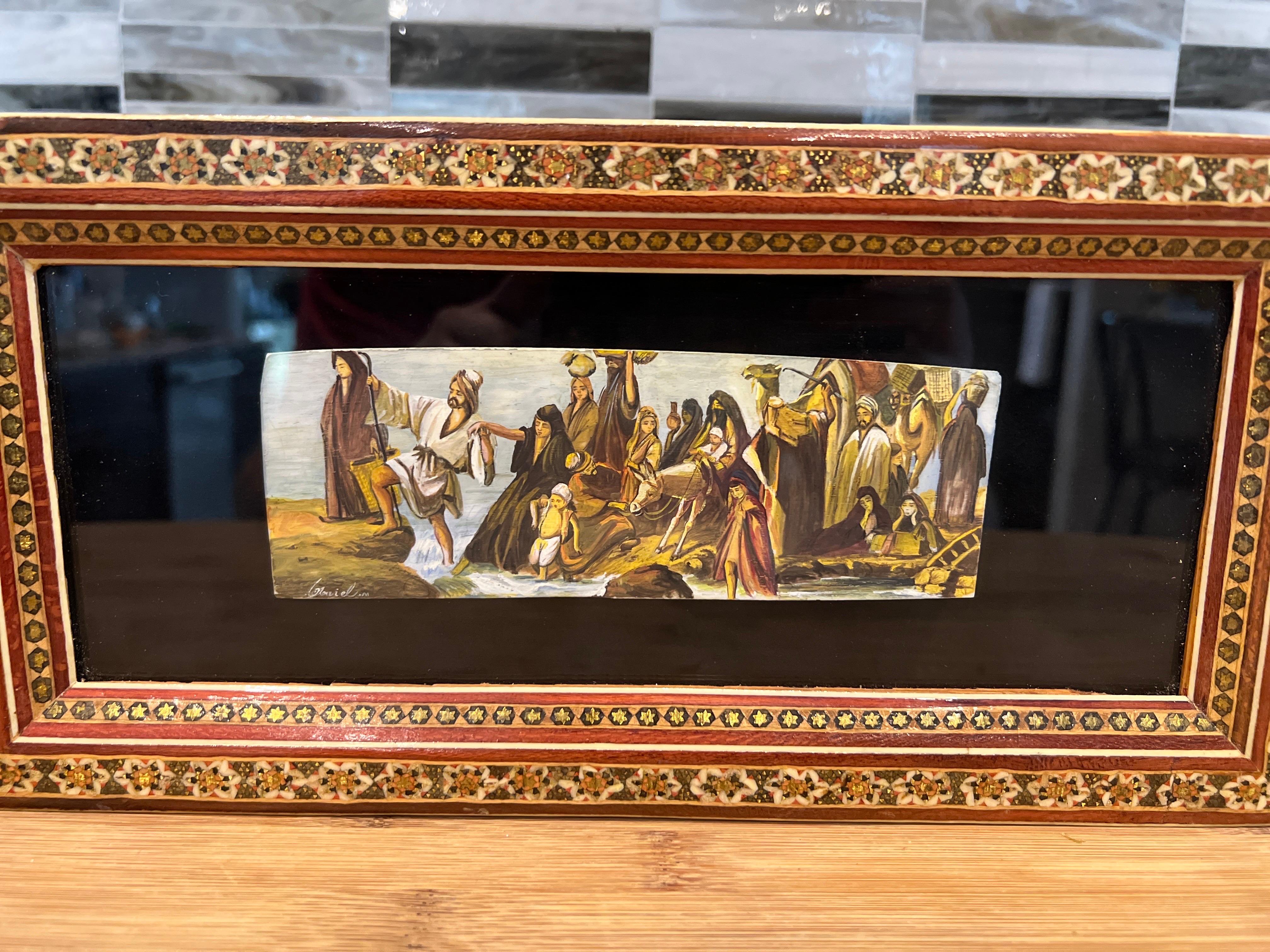 Vintage Persian Handmade Khatam Frame w/ Moses Crossing 

A fantastic micro mosaic frame with a framed camel bone hand painted Moses crossing. Signed to lower margin.
