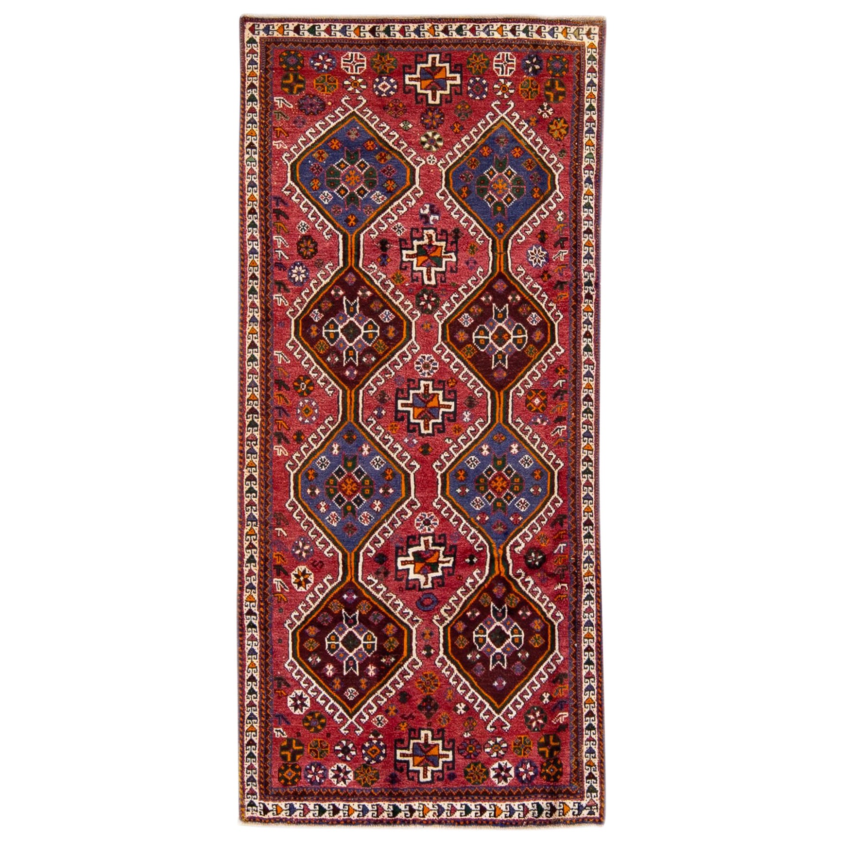 Tapis persan vintage en laine rouge à motifs tribaux faits à la main