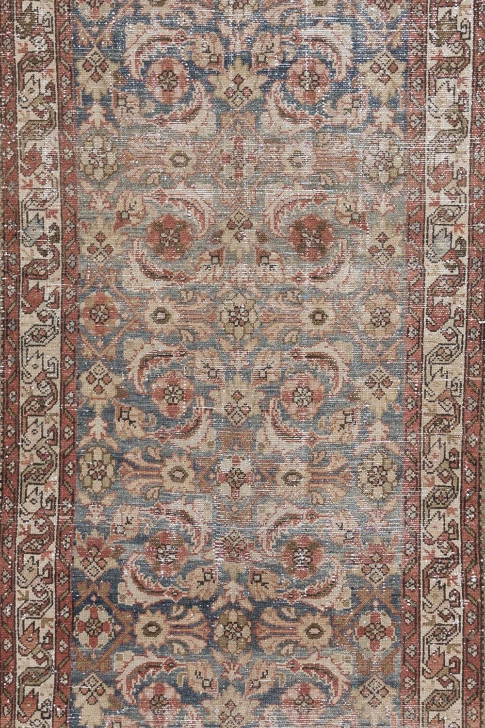 Age: Circa 1940

Colors: blue, blue-gray, rust, green, ivory

Pile: medium 

Wear Notes: 4

Material: wool on cotton

Vintage and antique rugs are by nature, pre-loved and may show evidence of their past. There are varying degrees of wear