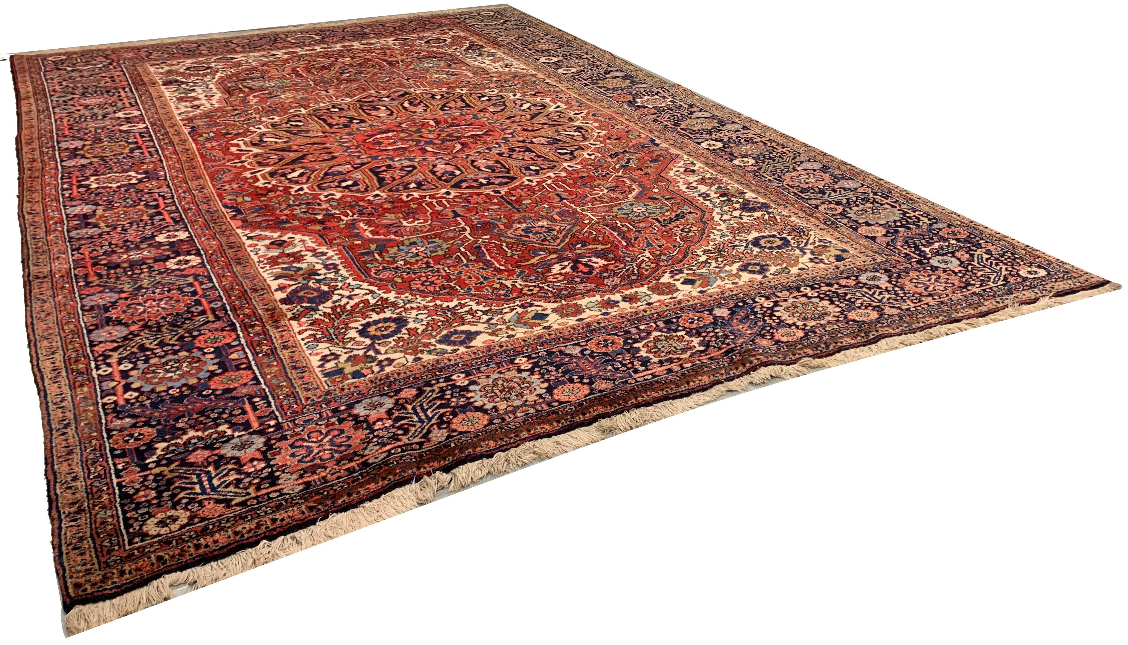 Vintage Persian Heriz Area rug, 8'2 x 12'. As perpetually fashionable as they are collectible, traditional Heriz rugs are skillfully woven in vibrant colors and emphatic geometric designs. The Heriz district of NW Persia has been weaving carpets for