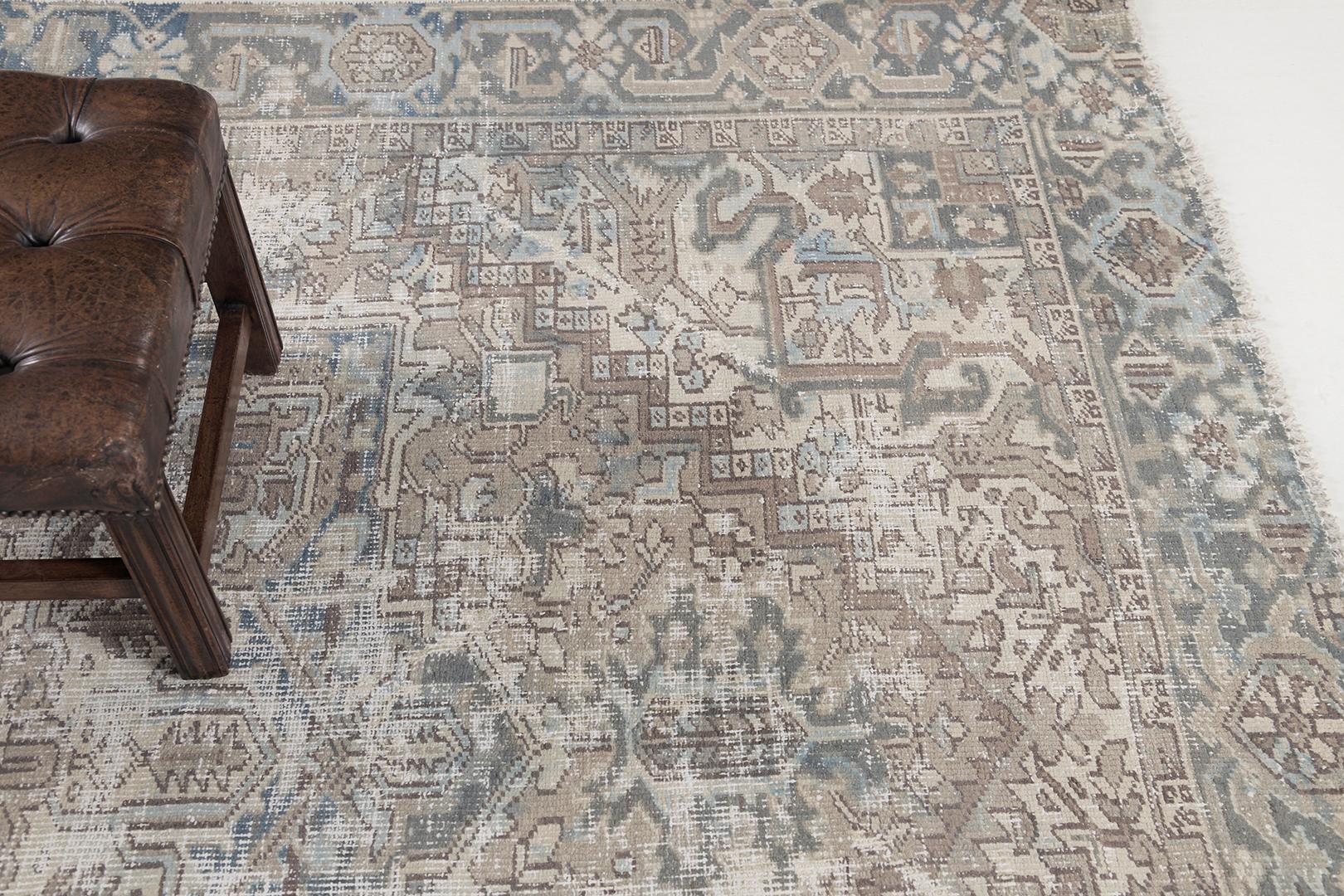 This magnificent Heriz rug has a beautiful combination of sage blue and neutral tones of Persian symbols that narrates the beautiful story in it. It consists of different representations that make the masterpiece priceless. Persian rugs are one of