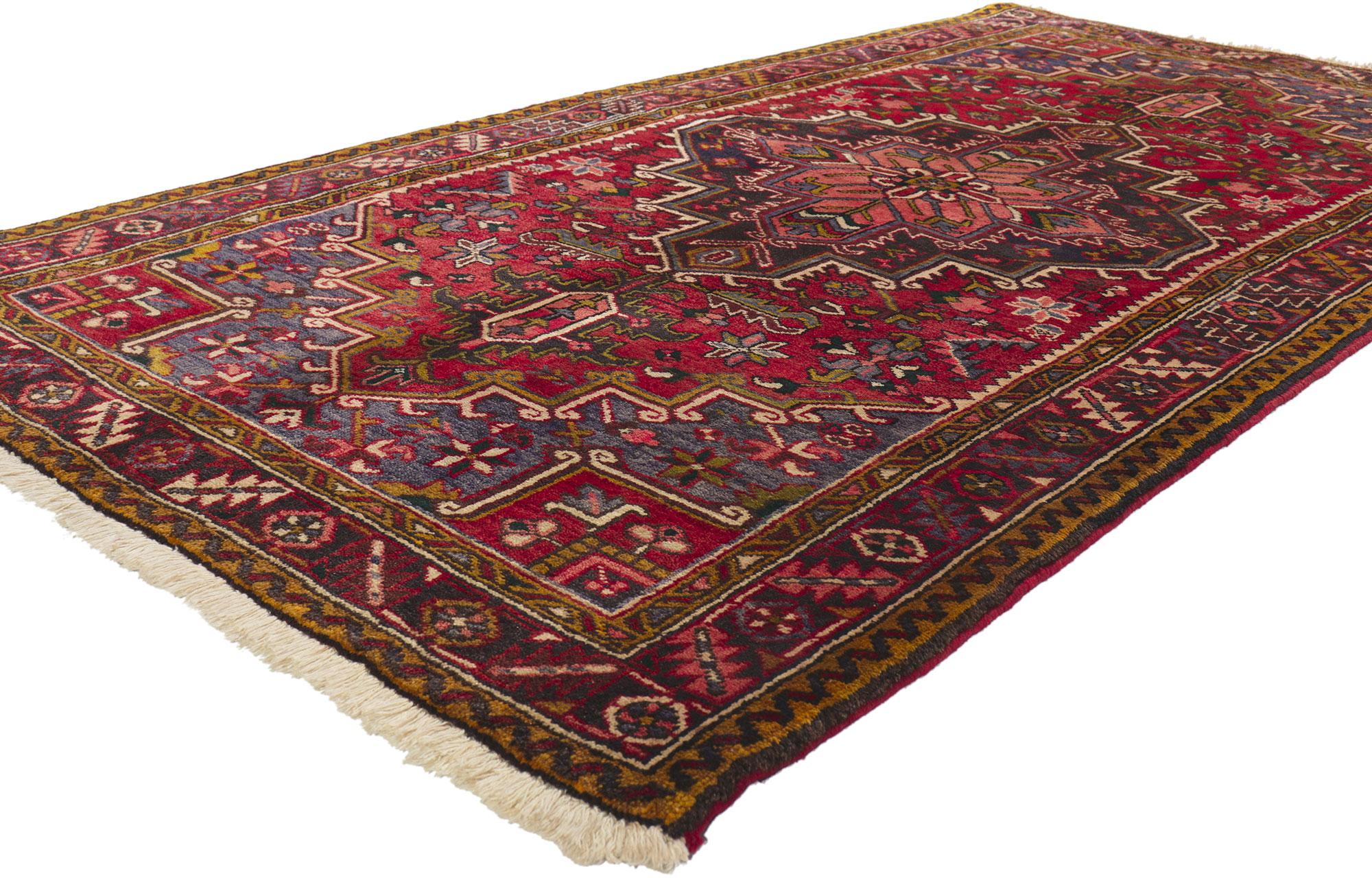 75103 Vintage Persian Heriz Rug, 04’00 x 07’08. Immerse yourself in the enchanting allure of this hand-knotted wool vintage Persian Heriz rug, a masterpiece that blends traditional craftsmanship with timeless elegance. The rug's centerpiece is a