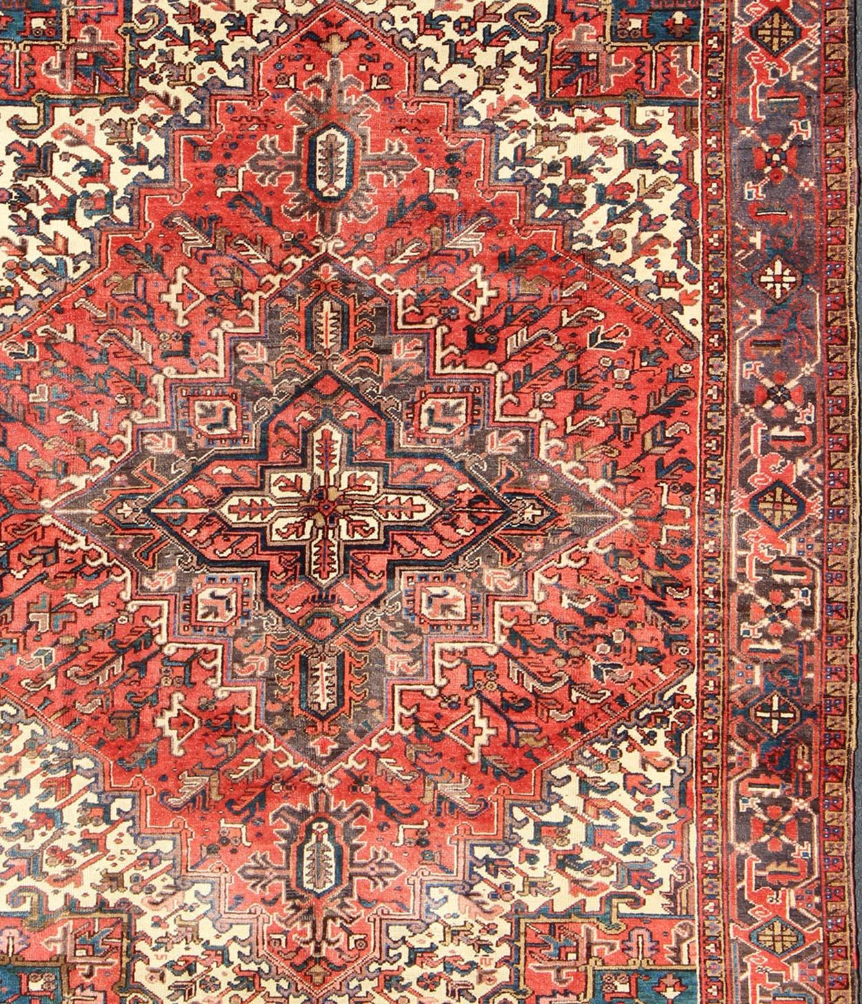 Hand-Knotted Vintage Persian Heriz Carpet with Geometric Medallion in Rust and Denim Blue