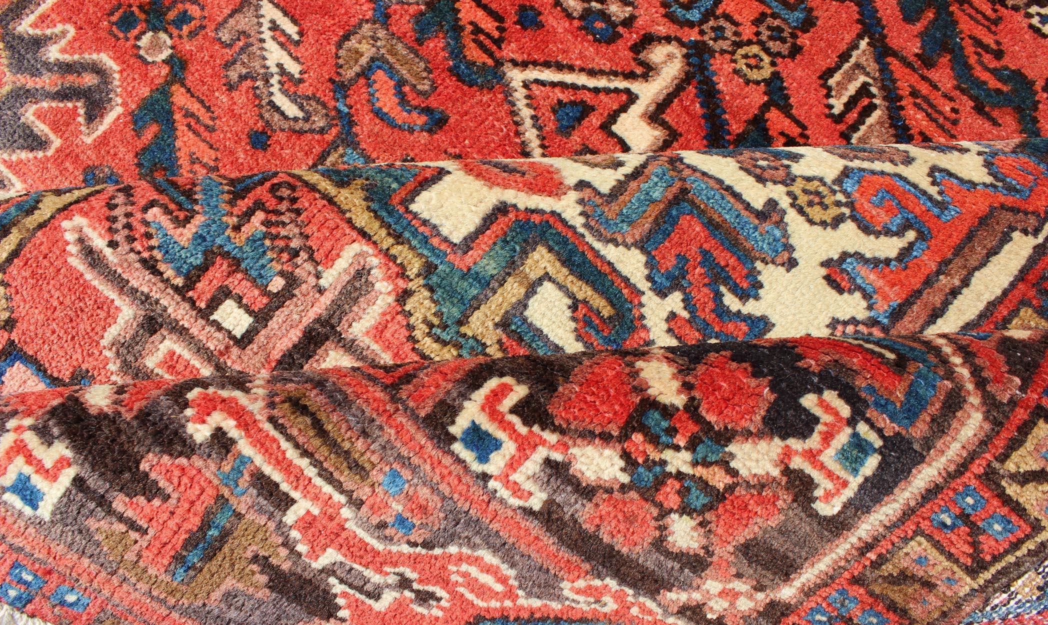 Vintage Persian Heriz Carpet with Geometric Medallion in Rust and Denim Blue In Good Condition In Atlanta, GA
