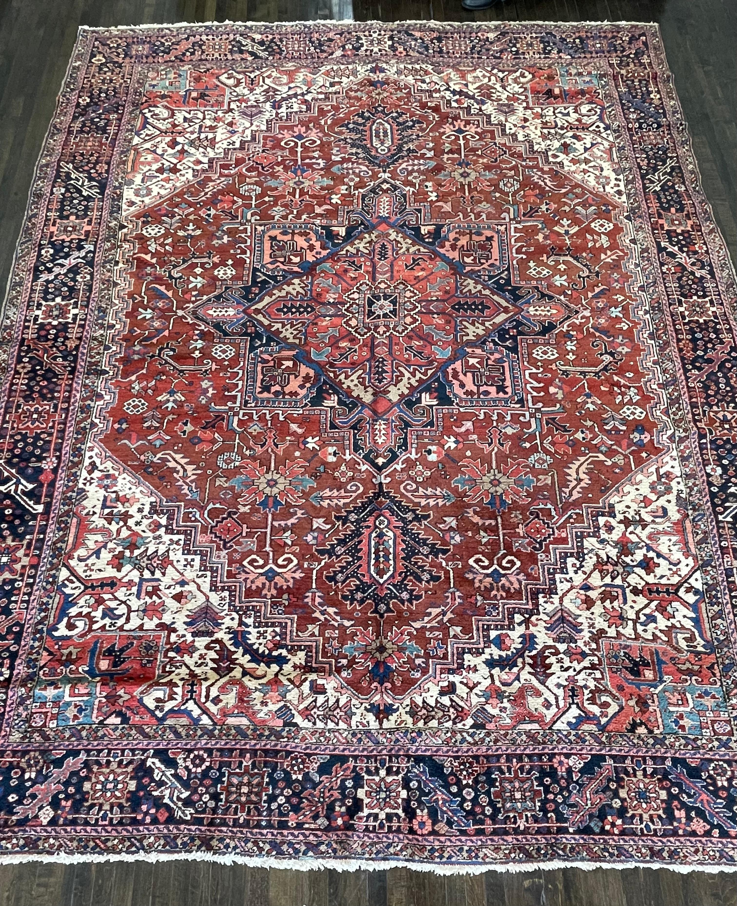 This carpet is handmade in the town of Heriz located northwest of Persia. The town of Heriz and its surrounding villages have formed one of the most prolific weaving centers in Persia for centuries.Heriz carpets have a cotton warp and double-cotton