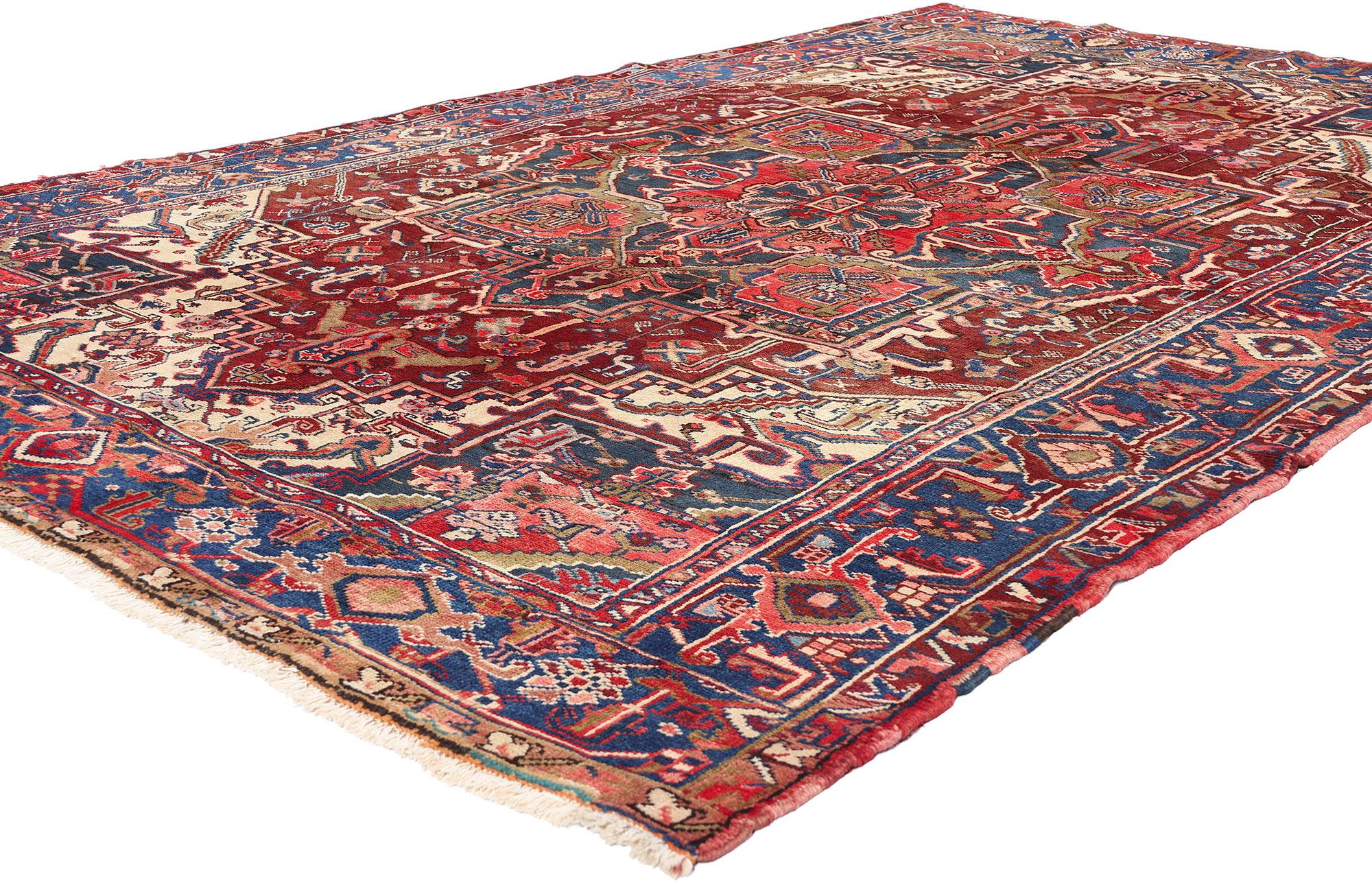 90010 Vintage Persian Heriz Rug, 06'09 x 10'07. Immerse yourself in the timeless elegance of this hand-knotted wool vintage Persian Heriz rug, a true masterpiece of traditional craftsmanship. The focal point of this enchanting Persian rug is the