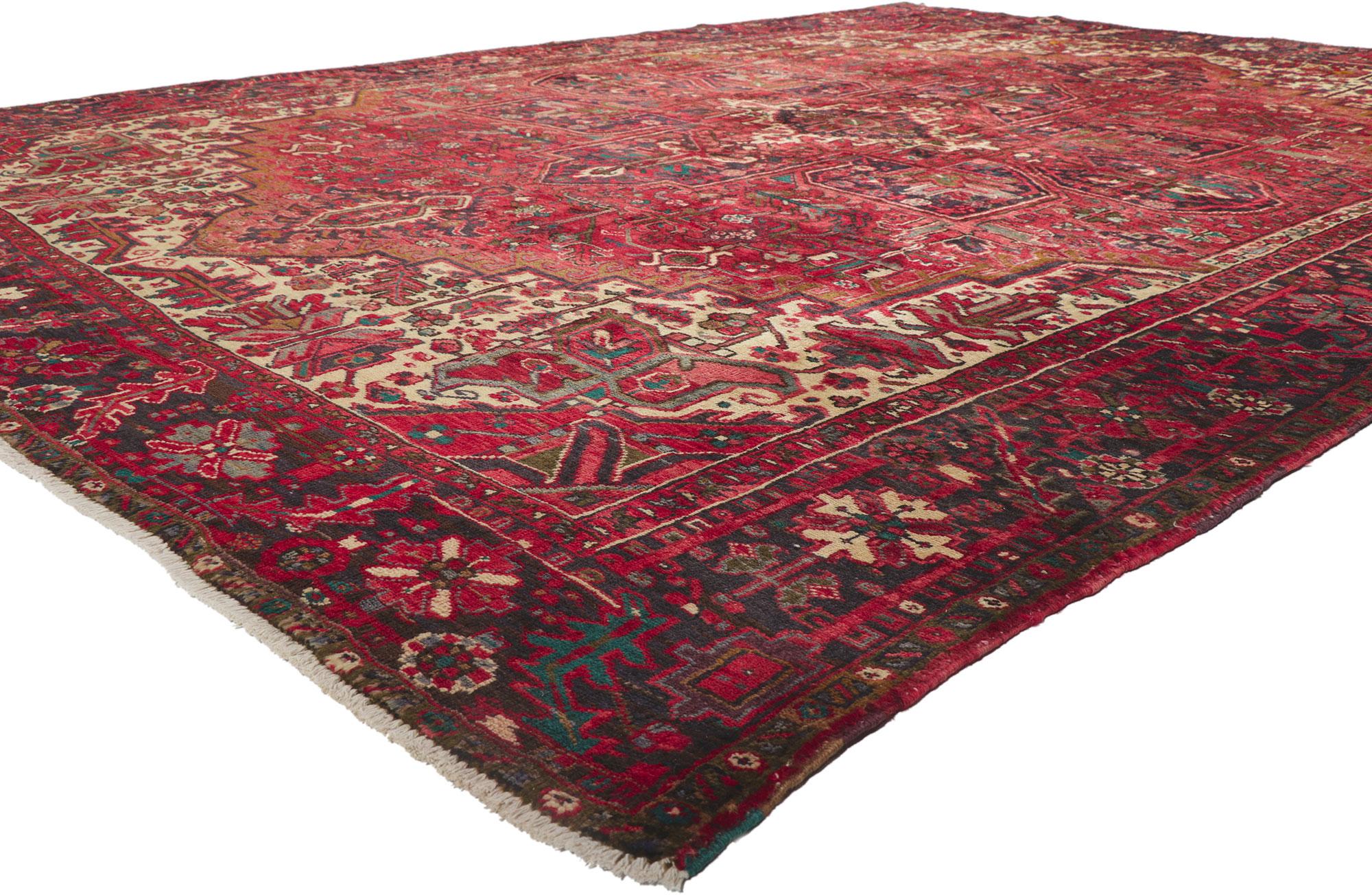 61191 vintage Persian Heriz rug, 10'02 x 13'04.
With its timeless style, incredible detail and texture, this hand knotted wool vintage Persian Heriz rug is a captivating vision of woven beauty. The sophisticated design and traditional color palette