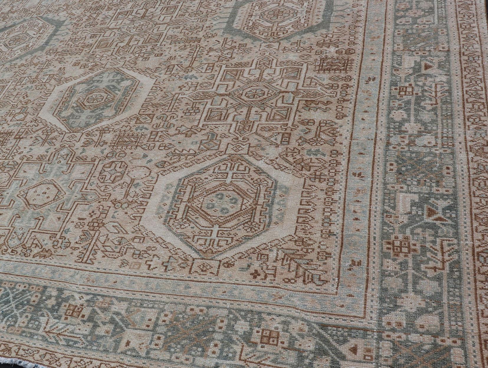 Heriz Serapi Vintage Persian Heriz Rug with All-Over Medallion Design in Tan and Blues For Sale
