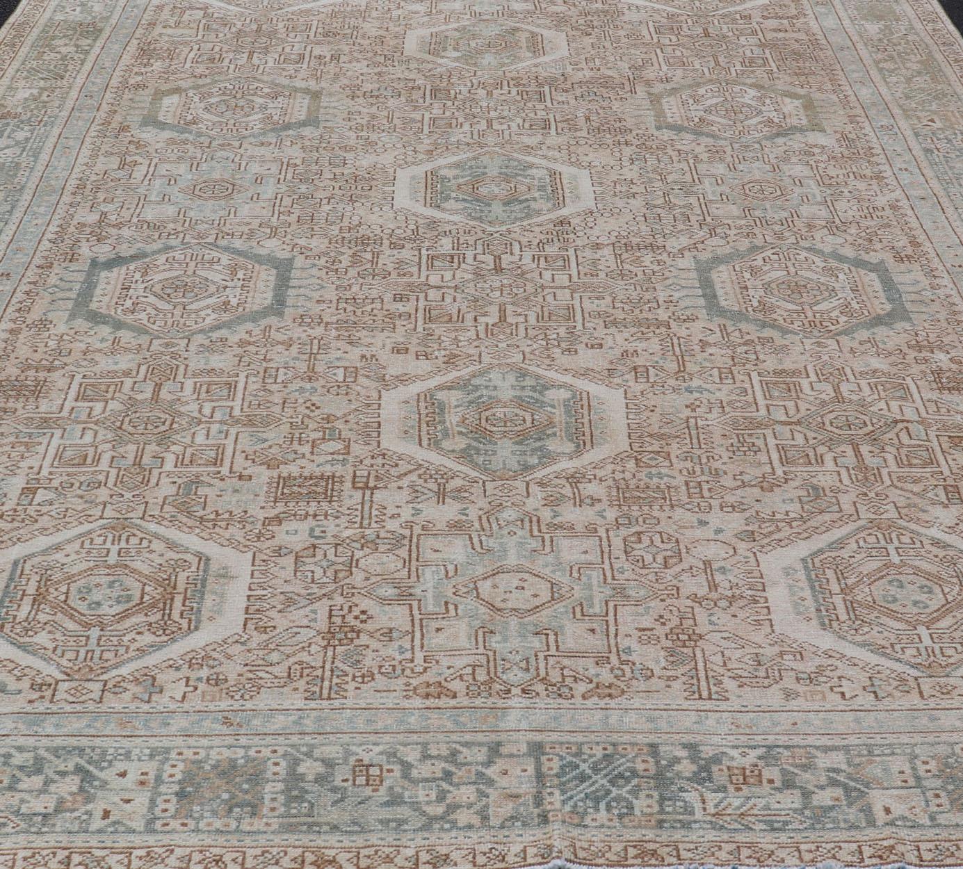 Wool Vintage Persian Heriz Rug with All-Over Medallion Design in Tan and Blues For Sale