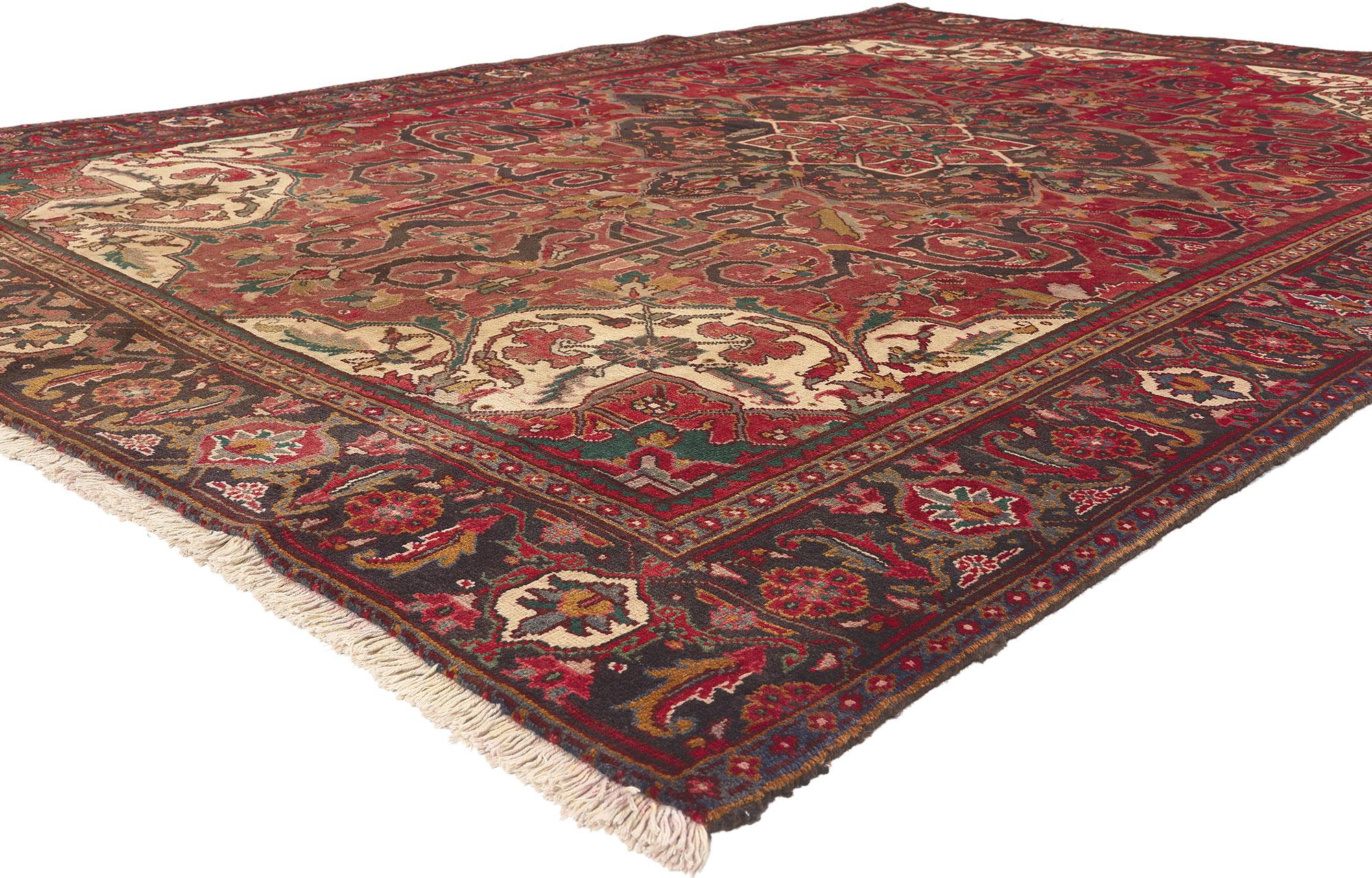 76235 Vintage Persian Heriz Rug with English Tudor Manor House Style. With timeless appeal, refined colors, and architectural design elements, this hand knotted wool vintage Persian Heriz rug can beautifully blend contemporary and traditional